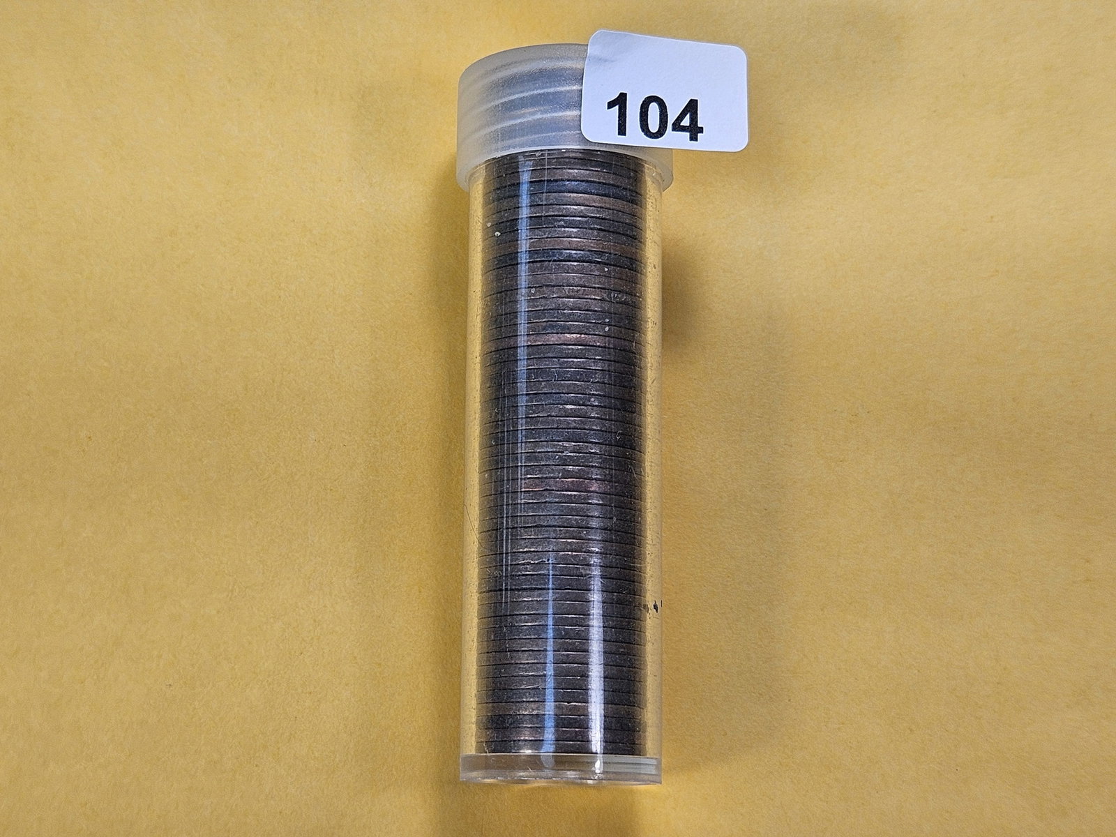 Fifty-seven Mixed Indian Head Cents: Mixed Dates and Grades, in Plastic Tube
