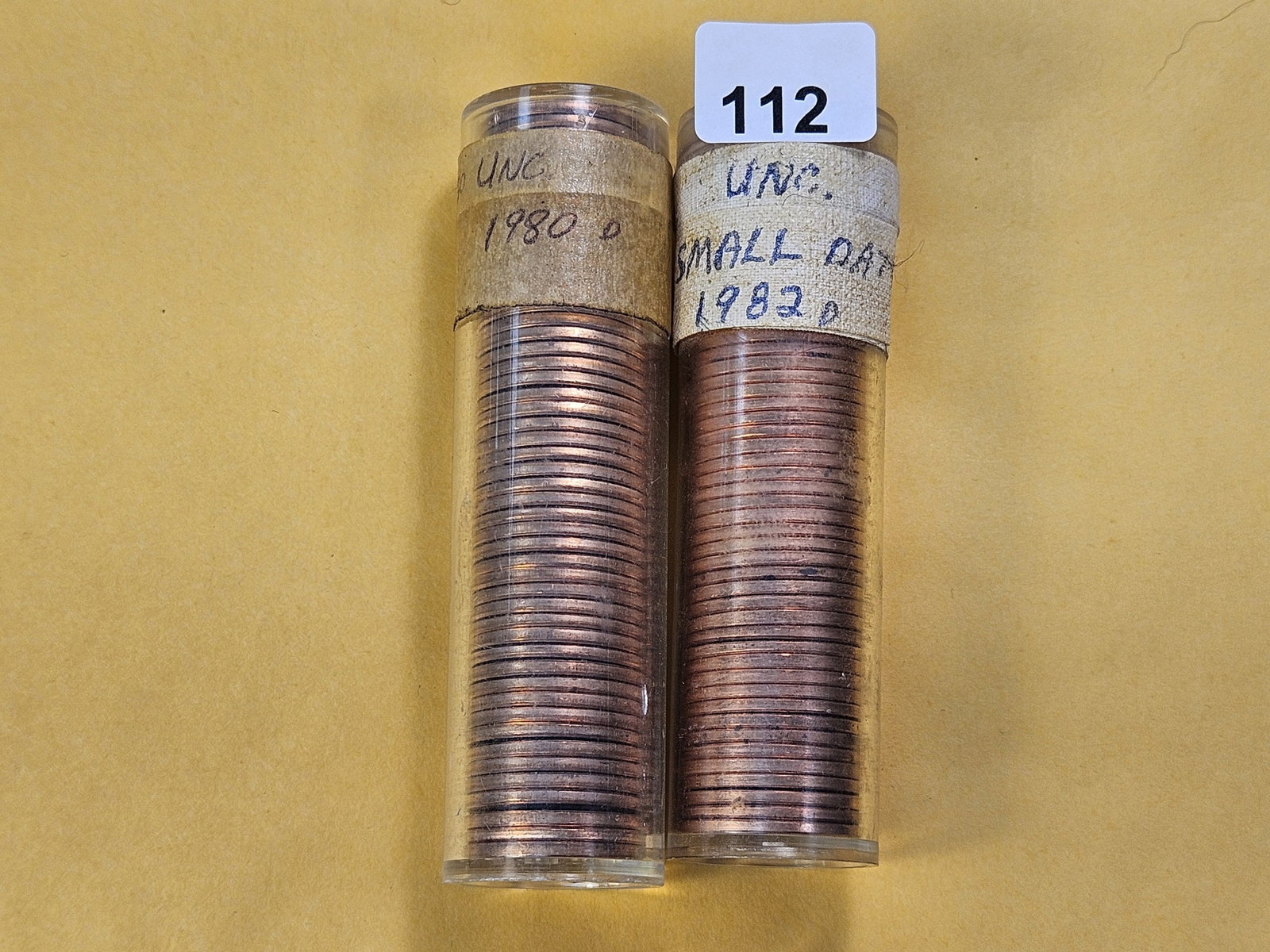 Two Brilliant Uncirculated Full Rolls of Lincoln Memorial Cents: 1980-D and 1982-D. In sealed plastic tubes, unchecked by us