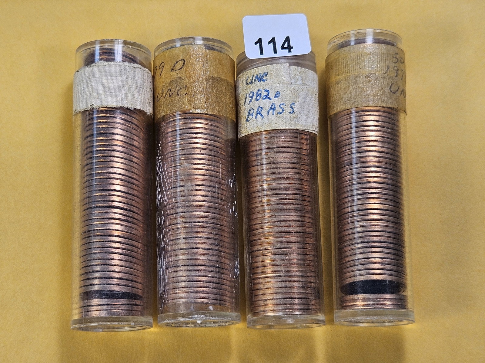 Three Full Rolls and an almost Full Roll of Lincoln Memorial Cents: All are Brilliant Uncirculated! Almost full 1963 Roll, two 1979-D and a 1982-D full rolls. All caps are sealed with tape