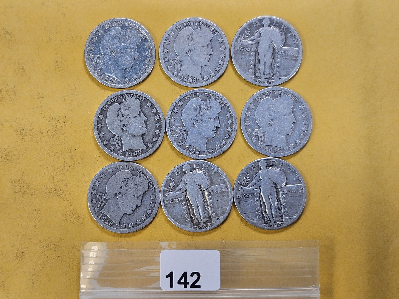 Nine United States Silver Quarters: Six Barber and three Standing Liberty Silver Quarters