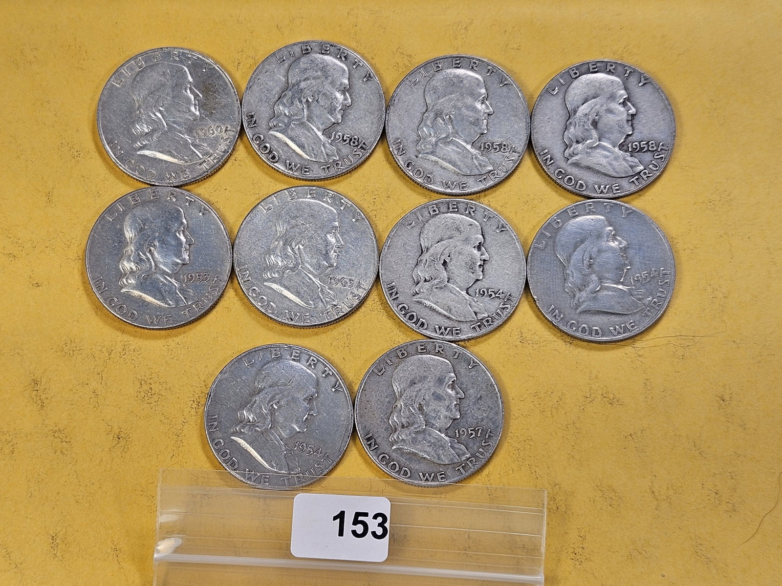 Ten Circulated Franklin Silver Half Dollars: Assorted Dates and Grades