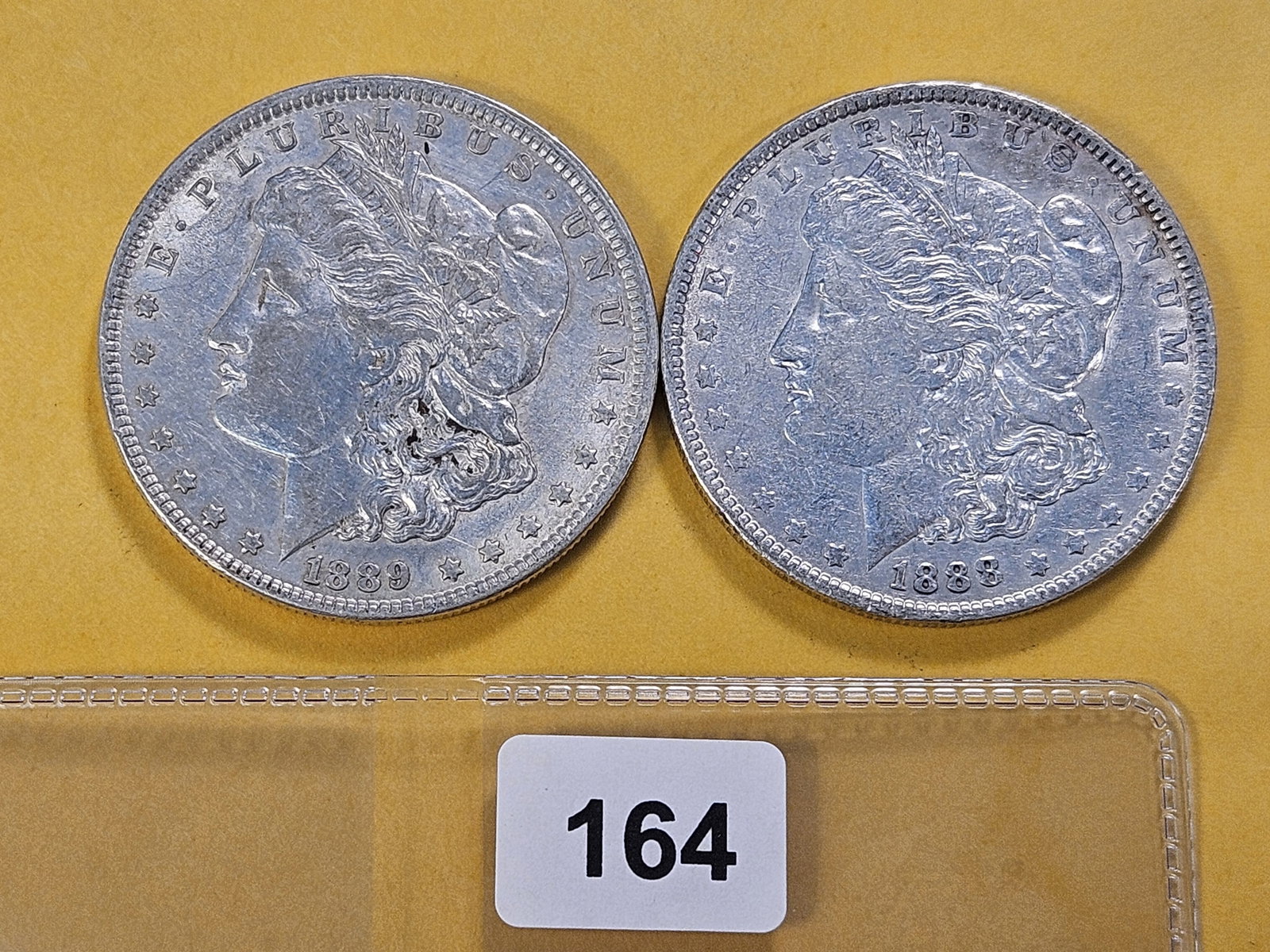 Two About Uncirculated Morgan Silver Dollars (1 of 4)