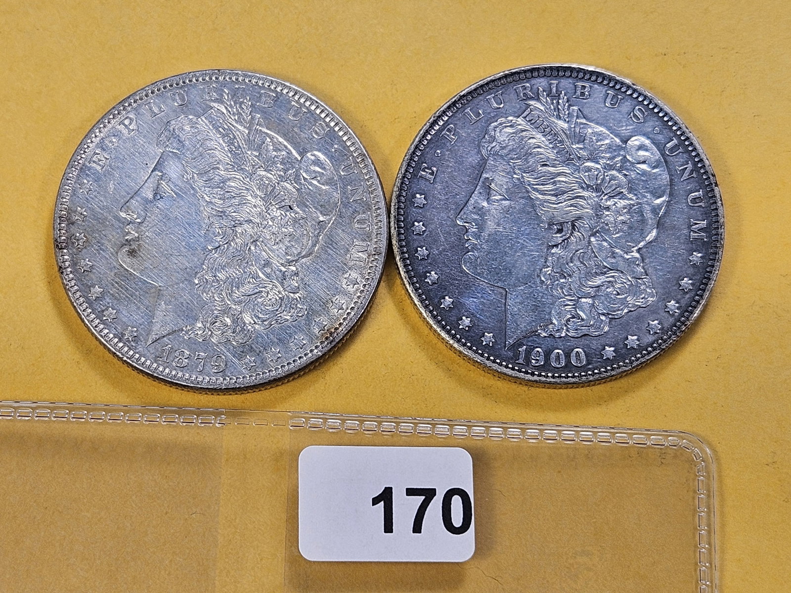 Two About Uncirculated Morgan Silver Dollars: 1879 and 1900