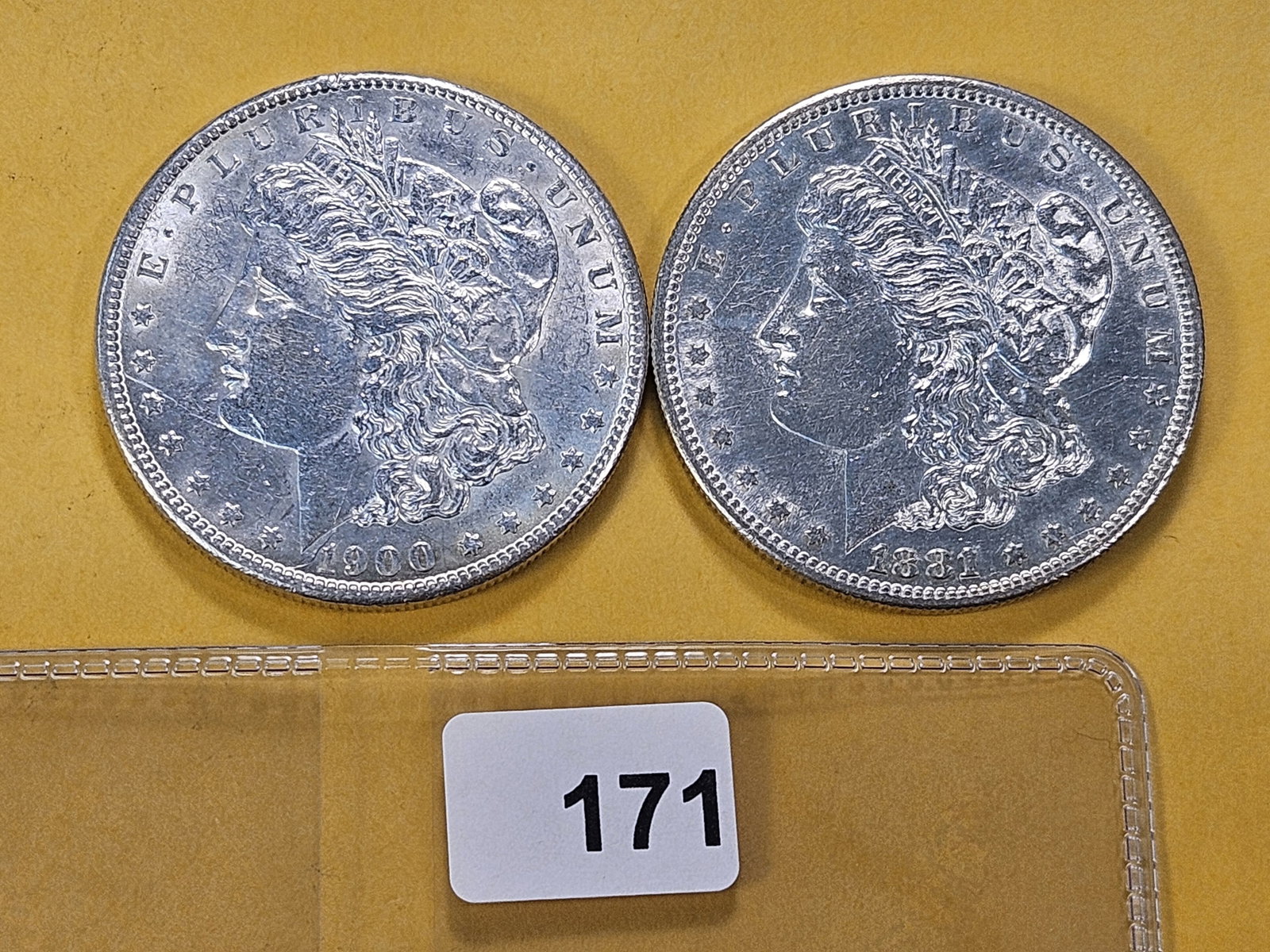 Two About Uncirculated Morgan Silver Dollars: 1881-S and 1900