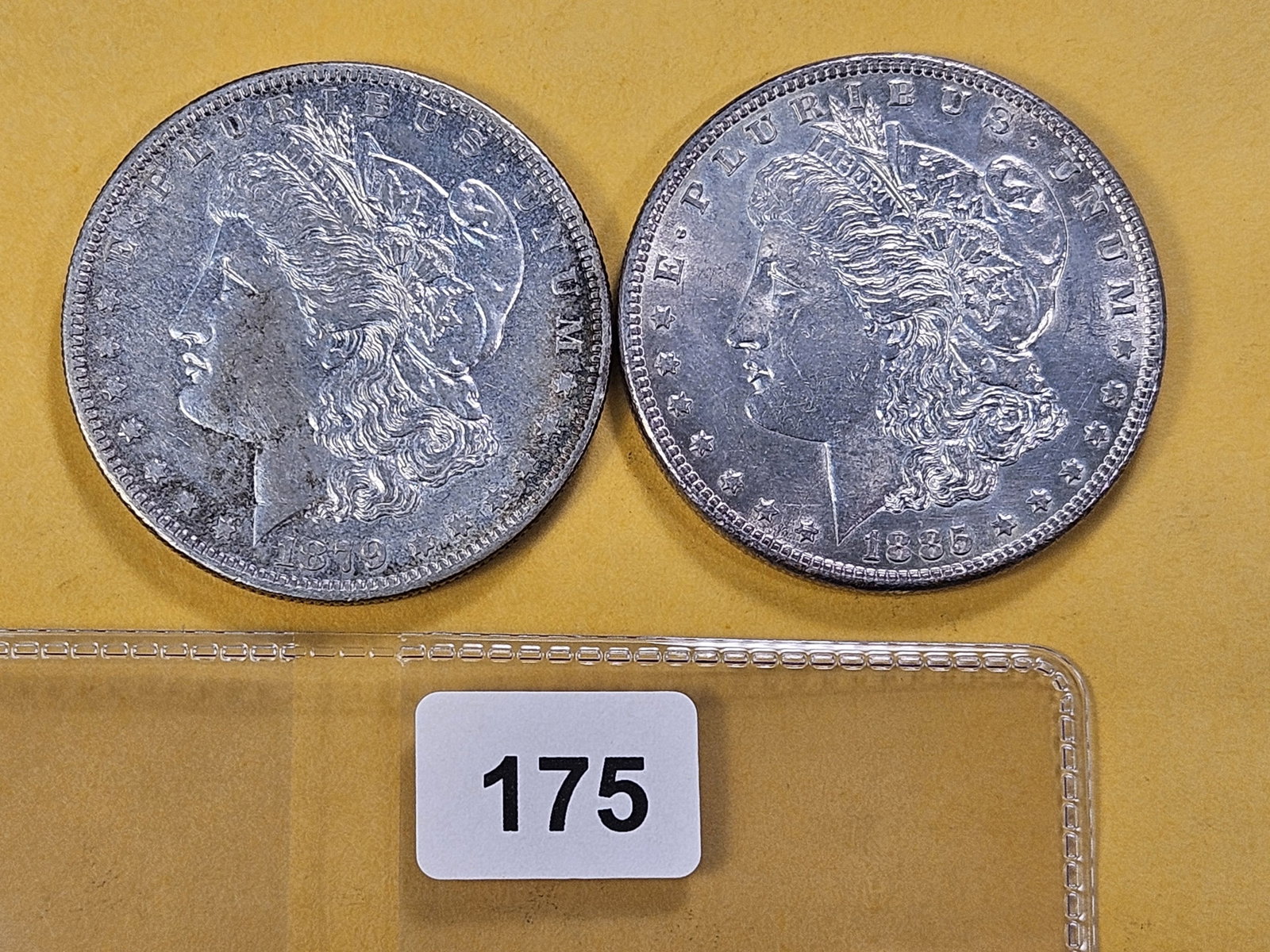 Two About Uncirculated Morgan Silver Dollars: 1879-O and 1885