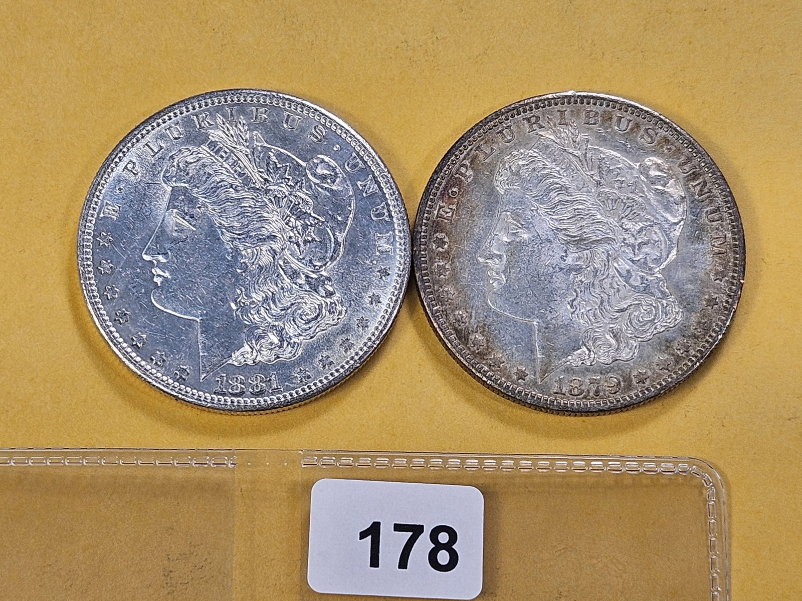 Two About Uncirculated Morgan Silver Dollars: 1879-S and 1881-S