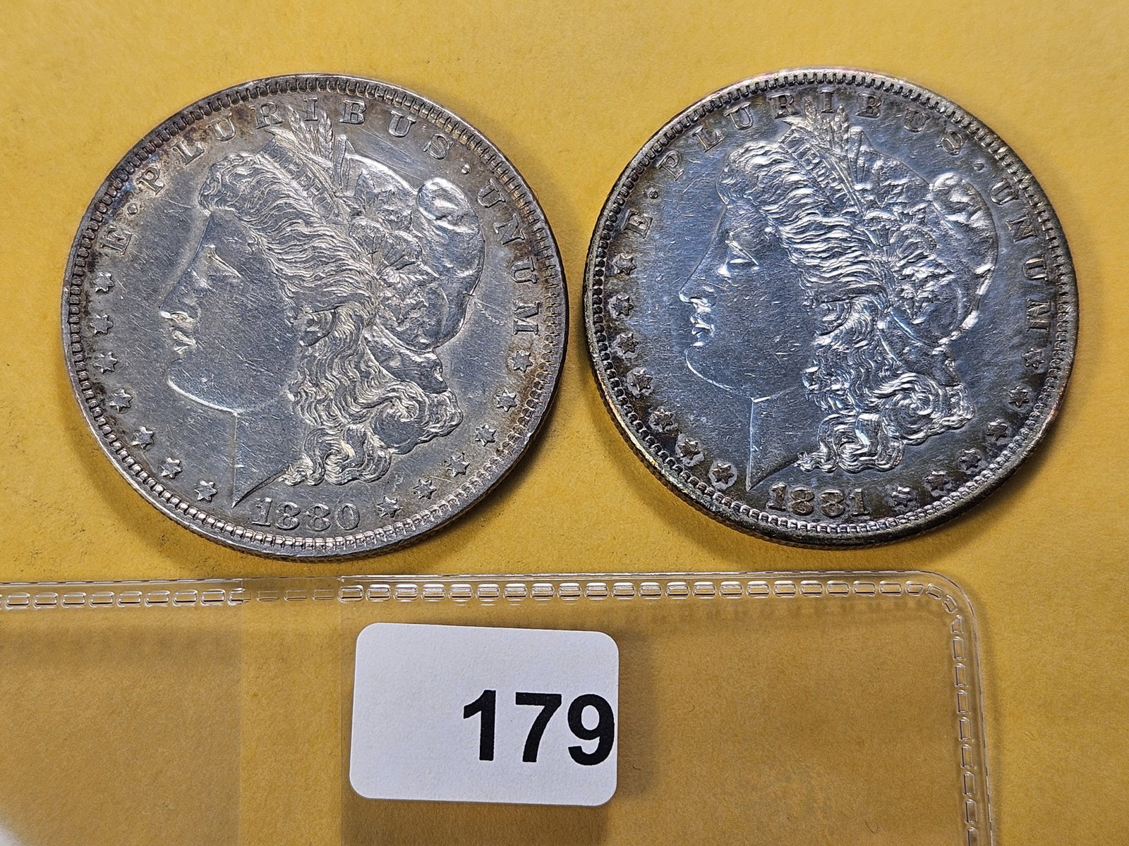 Two About Uncirculated Morgan Silver Dollars: 1880 and 1881-S