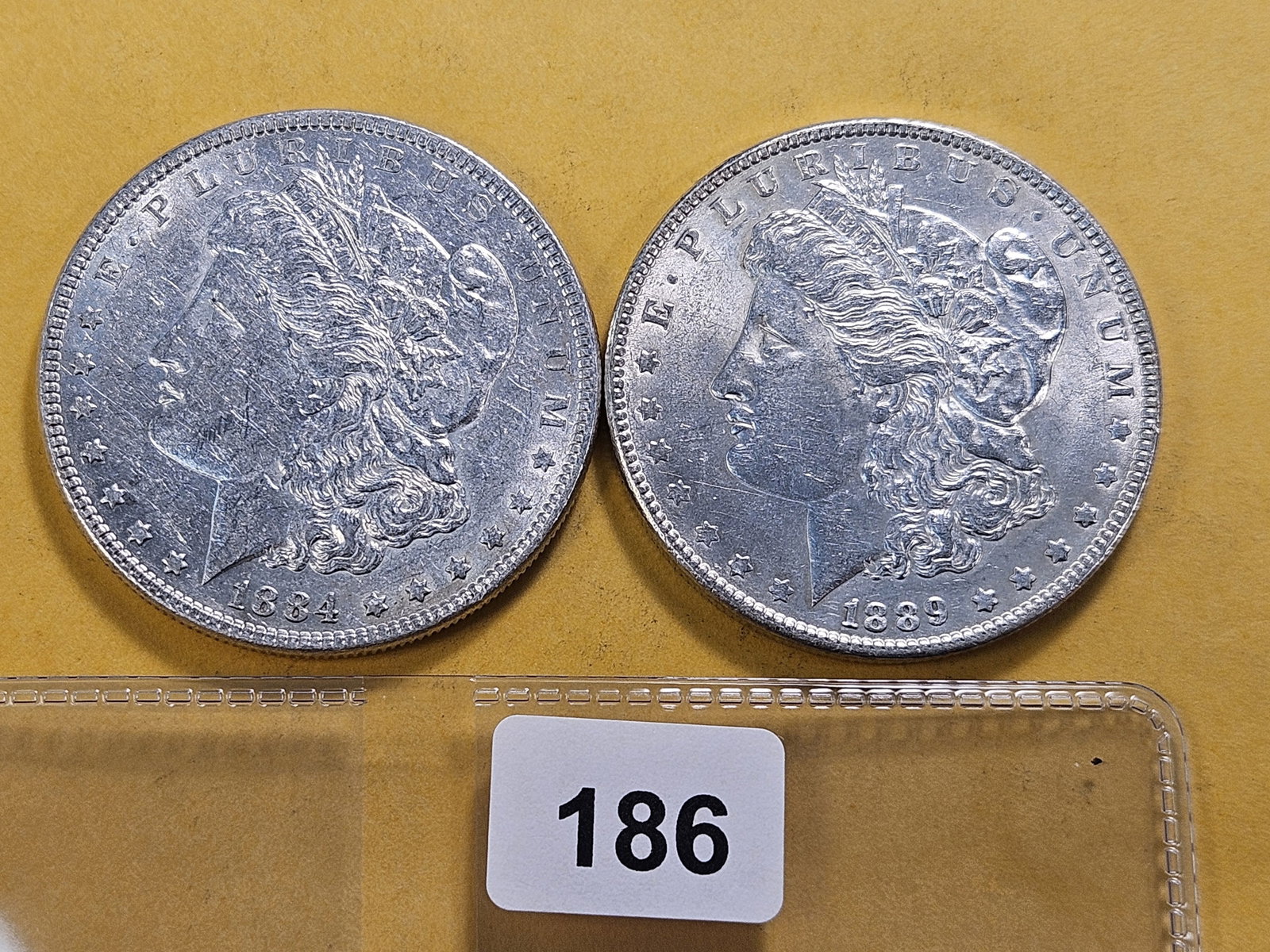 Two About Uncirculated Morgan Silver Dollars: 1884 and 1889