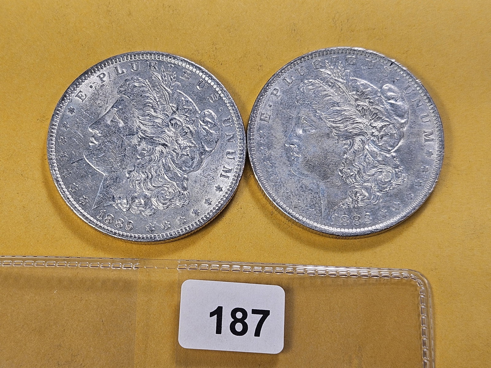 Two About Uncirculated Morgan Silver Dollars: 1883-O and 1889