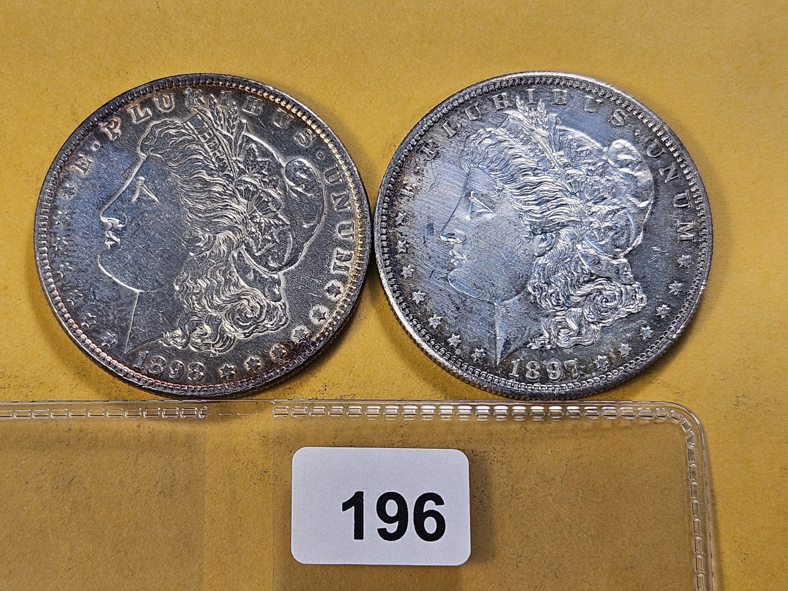 Two About Uncirculated Morgan Silver Dollars: 1897-S and 1898