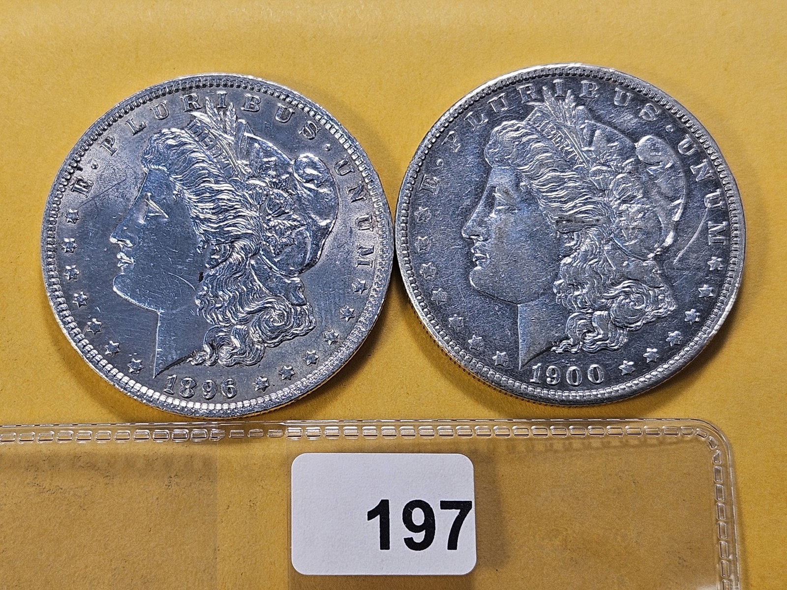 Two About Uncirculated Morgan Silver Dollars: 1896 and 1900