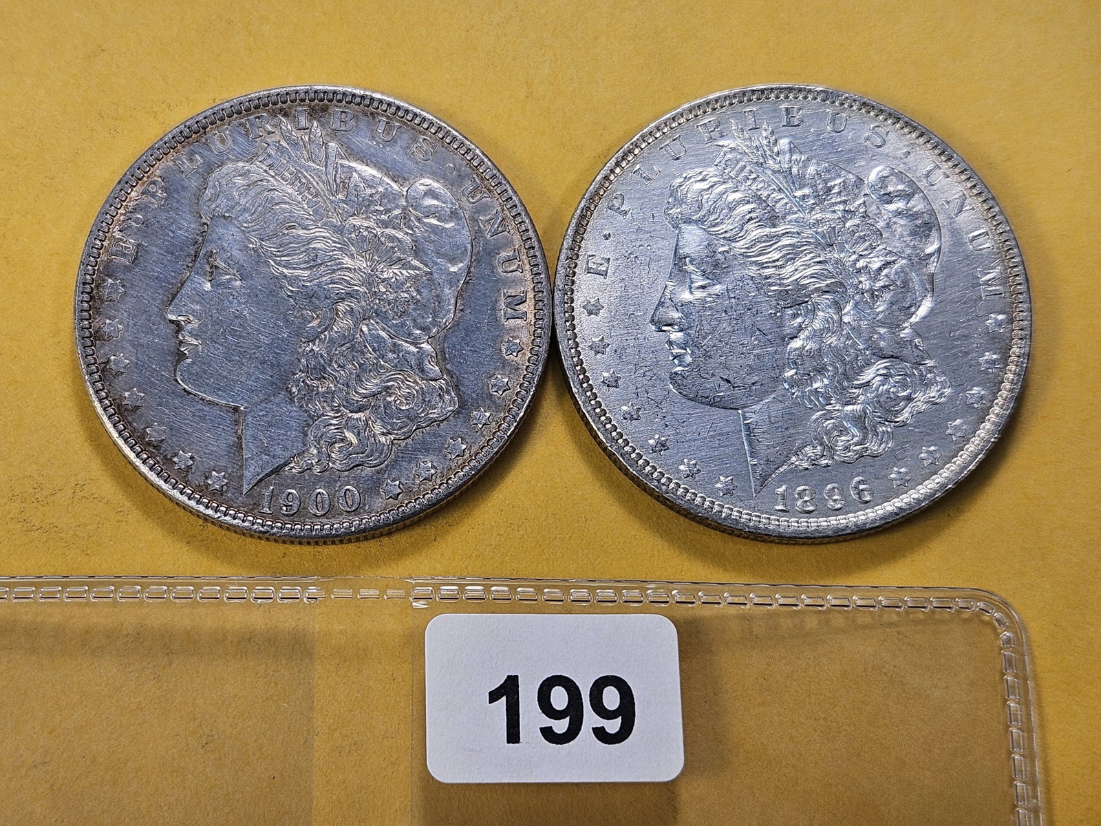 Two About Uncirculated Morgan Silver Dollars (1 of 4)