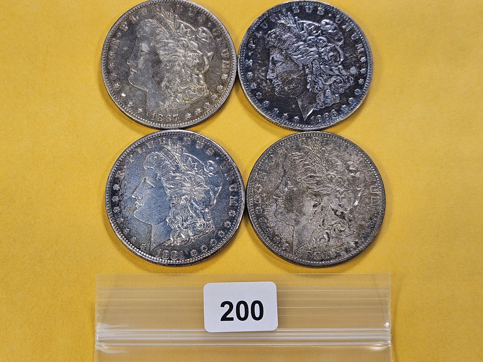 Four Morgan Silver Dollars (1 of 4)