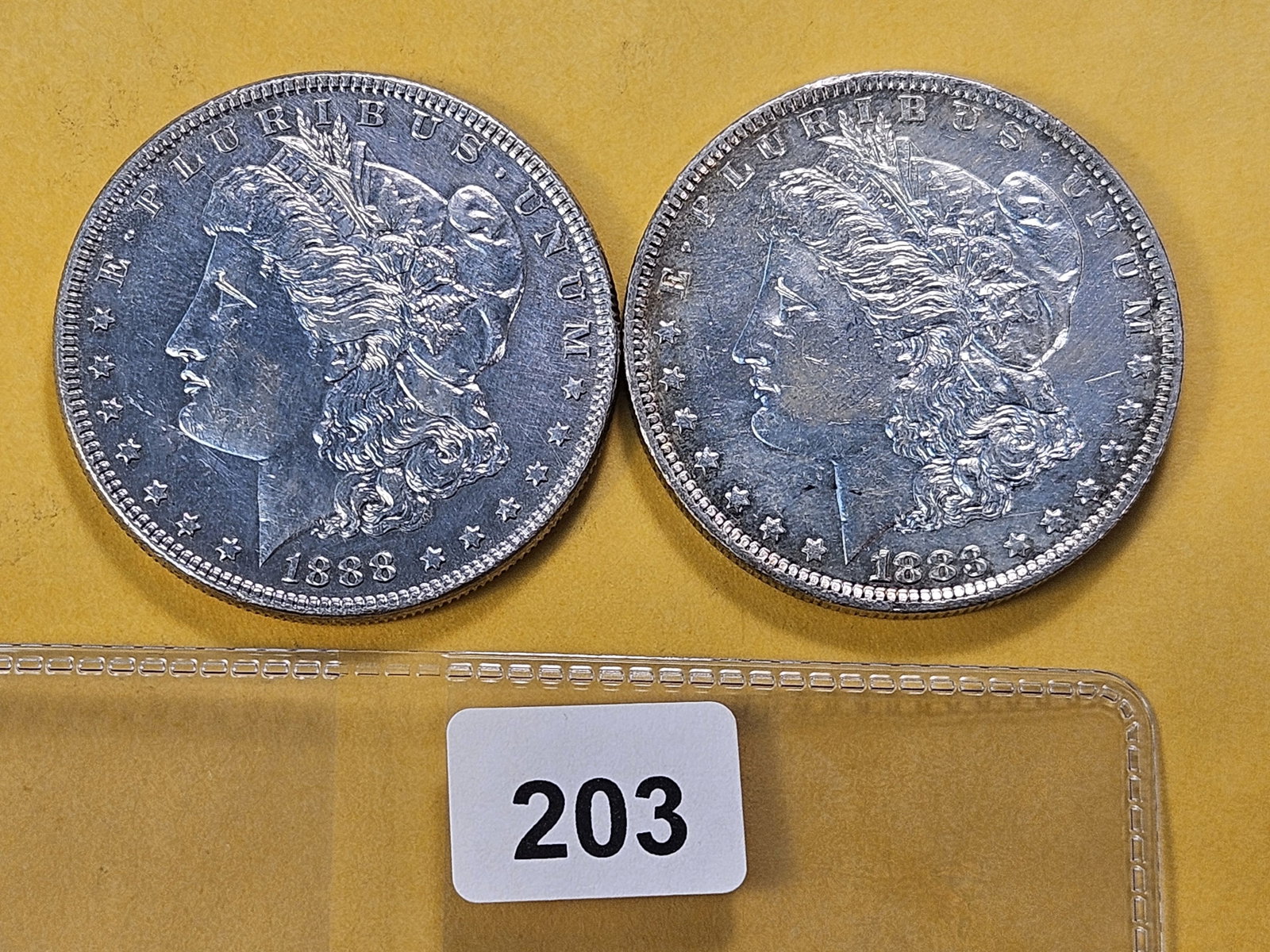 Two About Uncirculated Morgan Silver Dollars: 1883-O and 1888