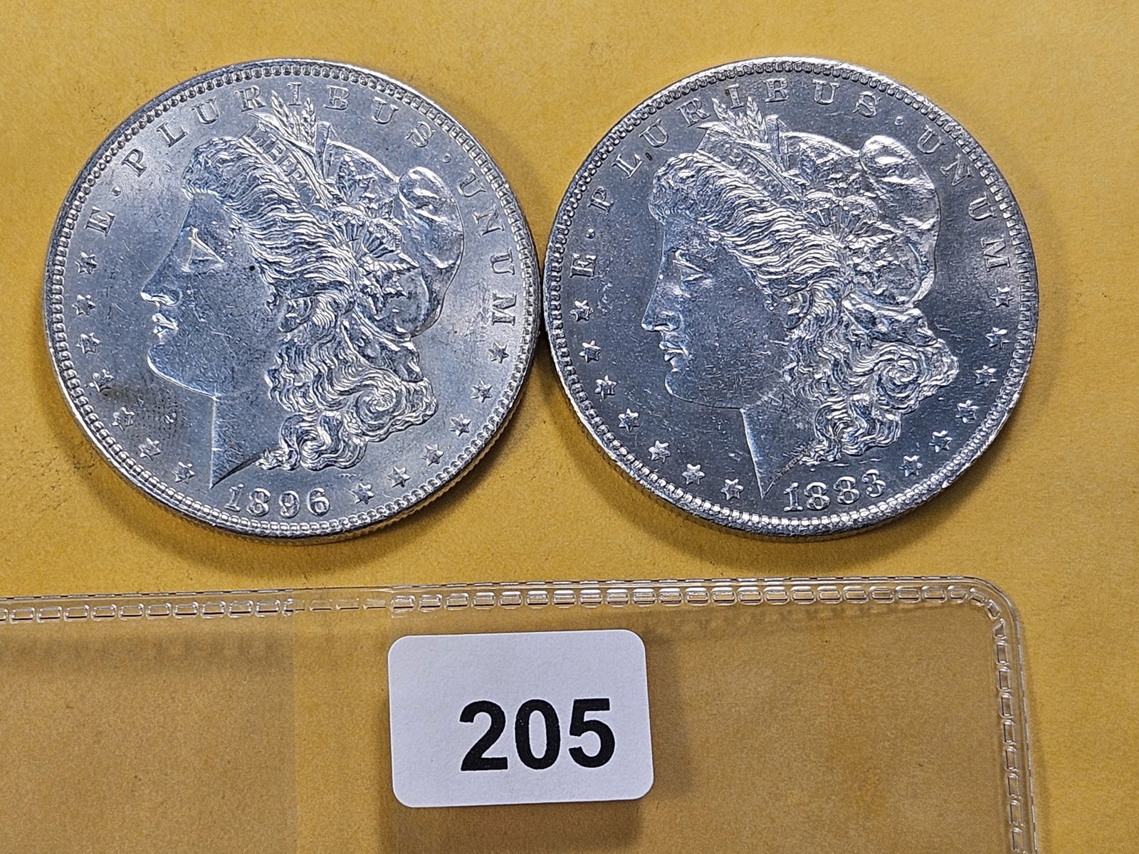 Two About Uncirculated Morgan Silver Dollars (1 of 4)