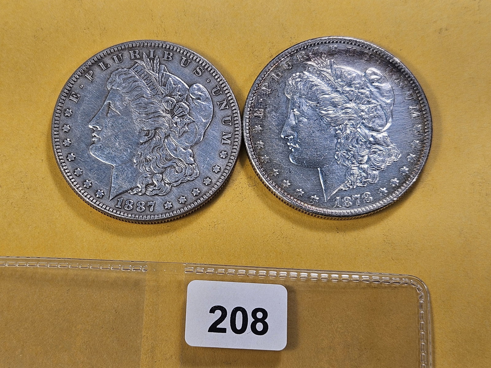 Two About Uncirculated Morgan Silver Dollars: 1878-S and 1887