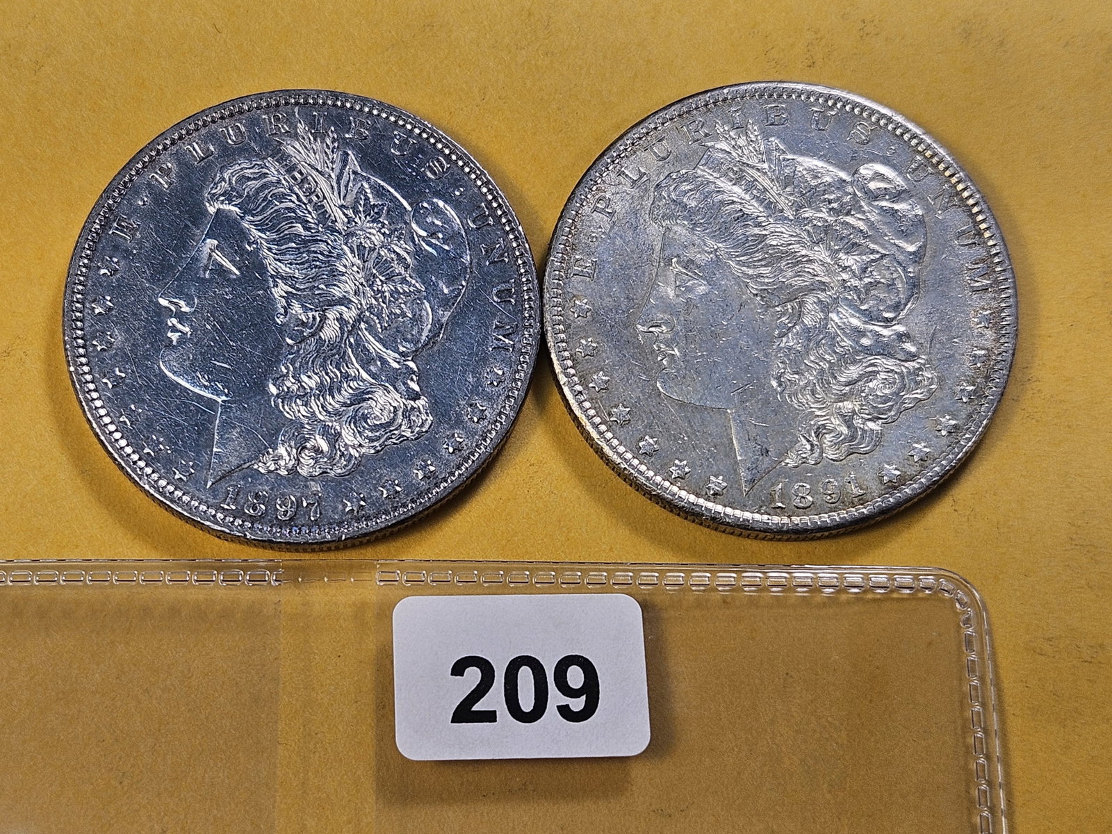 Two About Uncirculated Morgan Silver Dollars: 1891-S and 1897