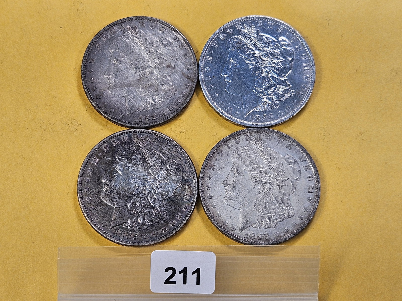 Four Morgan Silver Dollars (1 of 5)