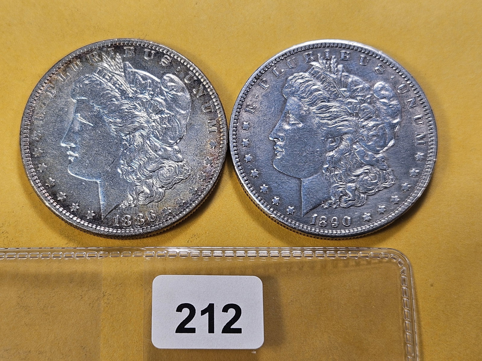 Two About Uncirculated Morgan Silver Dollars: 1886 and 1890