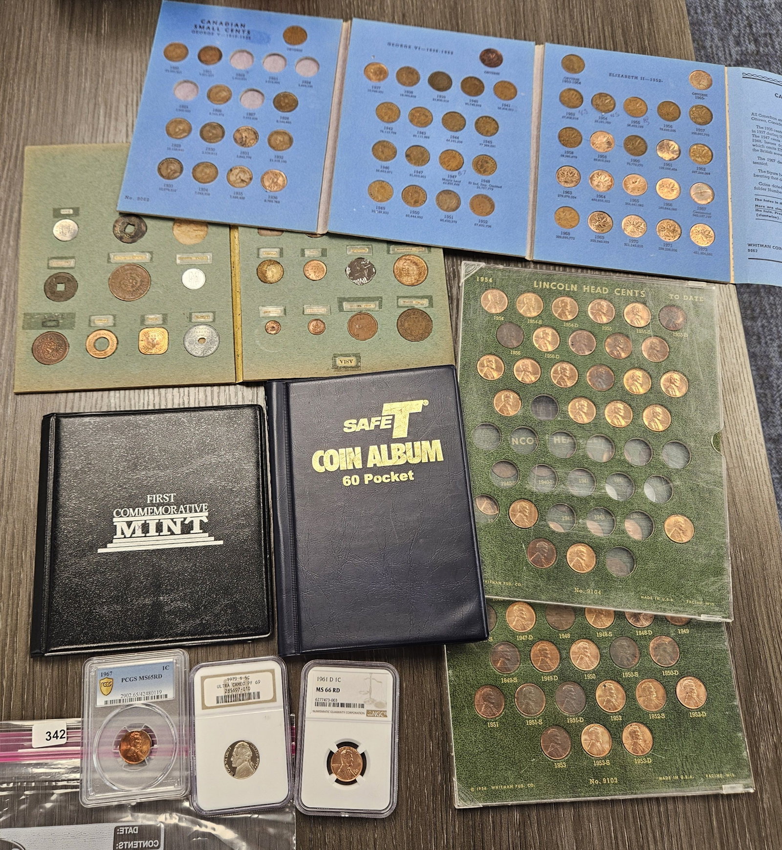 HODGEPODGE LOT!: Lincoln Coin Sets, Canadian Whitman Penny Album, Foreign Coin Book, empty coin storage book and NGC and PCGS Graded Lincoln Memorial Cents and NGC Jefferson Nickel