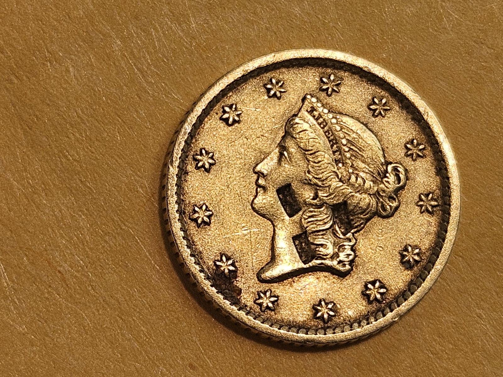 GOLD! 1852 Gold Dollar in About Uncirculated - details: Not sure if those are Chop Marks or what on the obverse