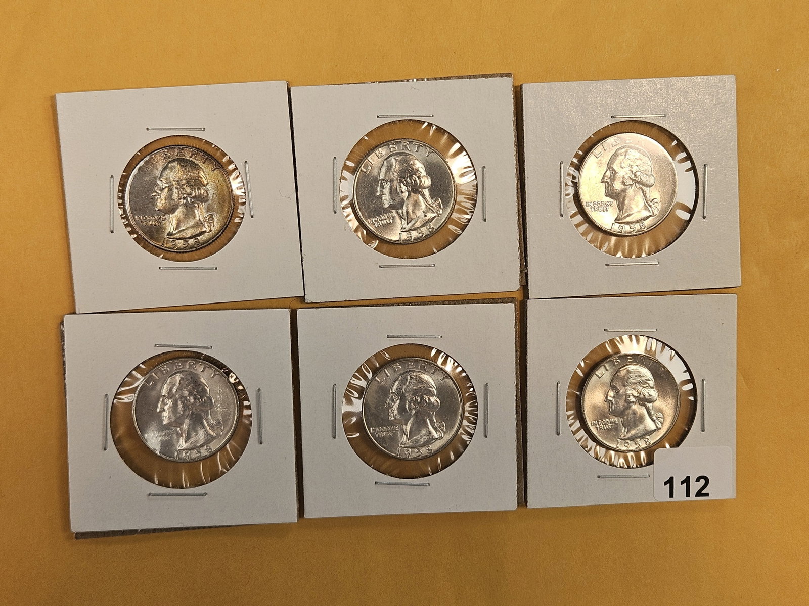 Six Very Choice to GEM Brilliant Uncirculated 1958-D Washington silver Quarters: One with end-roll toning