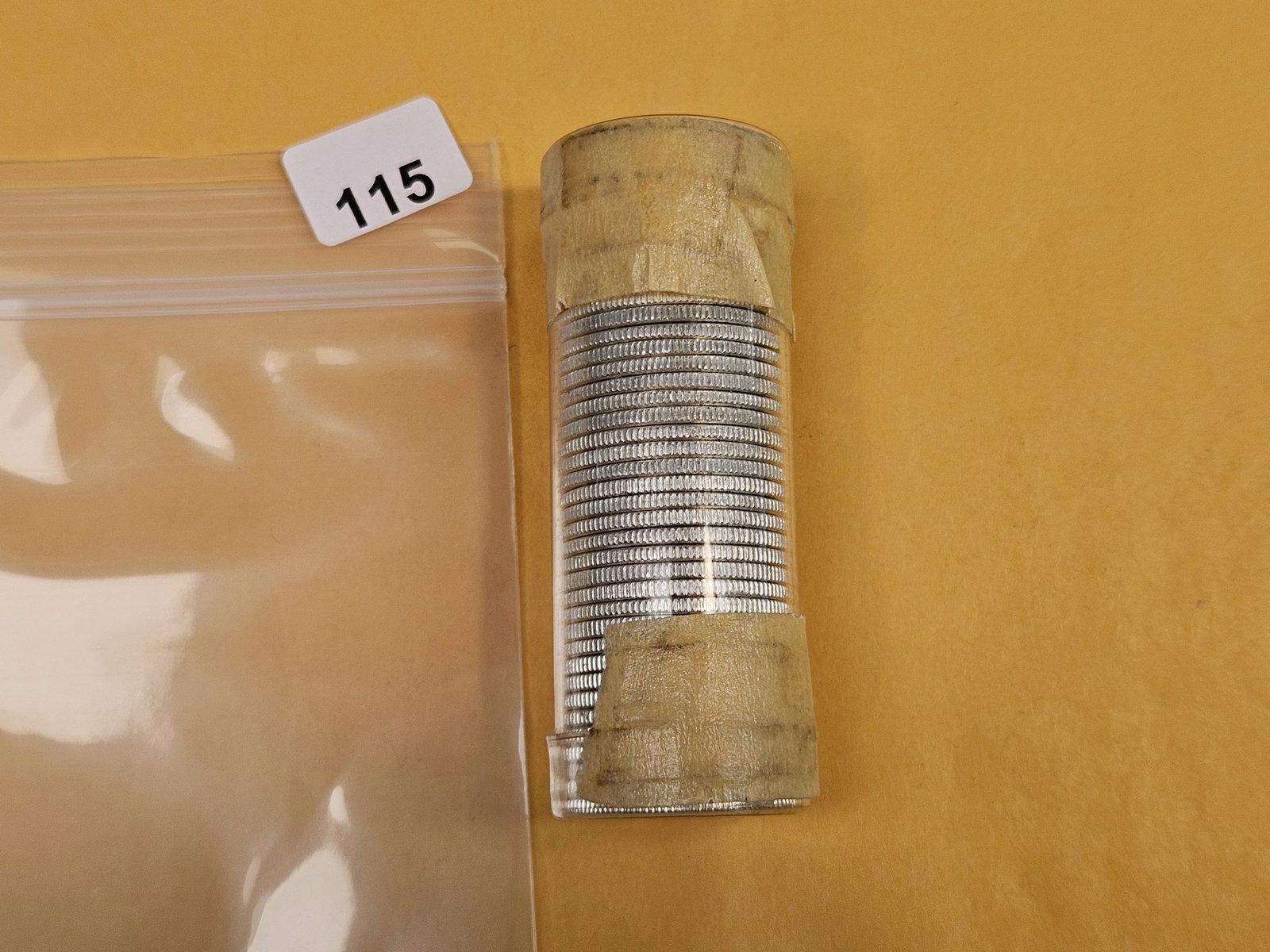 ** Full roll of Brilliant Uncirculated 1958 Washington silver Quarters: Came to us taped shut. We didn't open or search