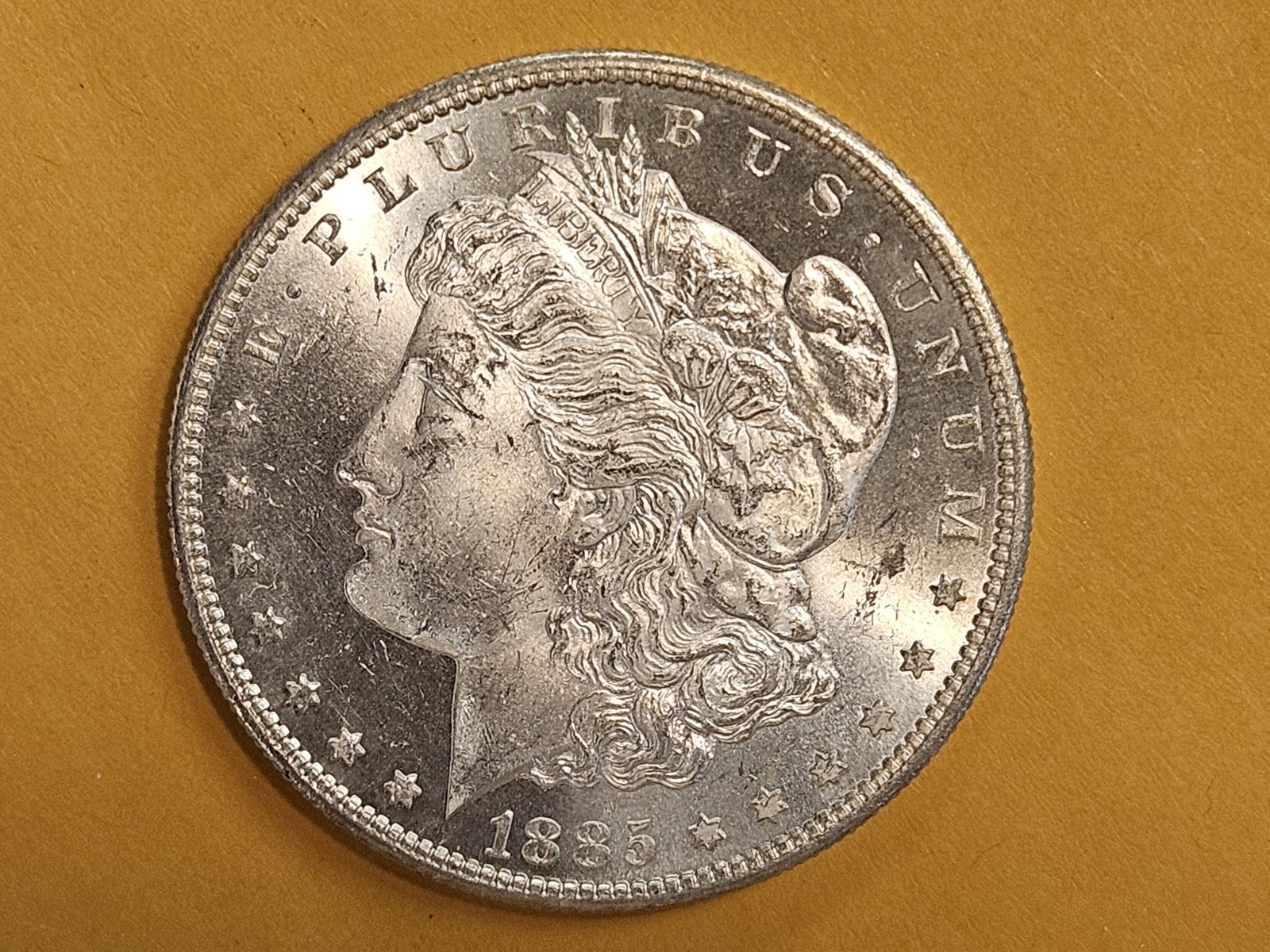 * Semi-key 1885-S Morgan Dollar in Choice Brilliant Uncirculated plus: Deep contrast. Near Prooflike!
