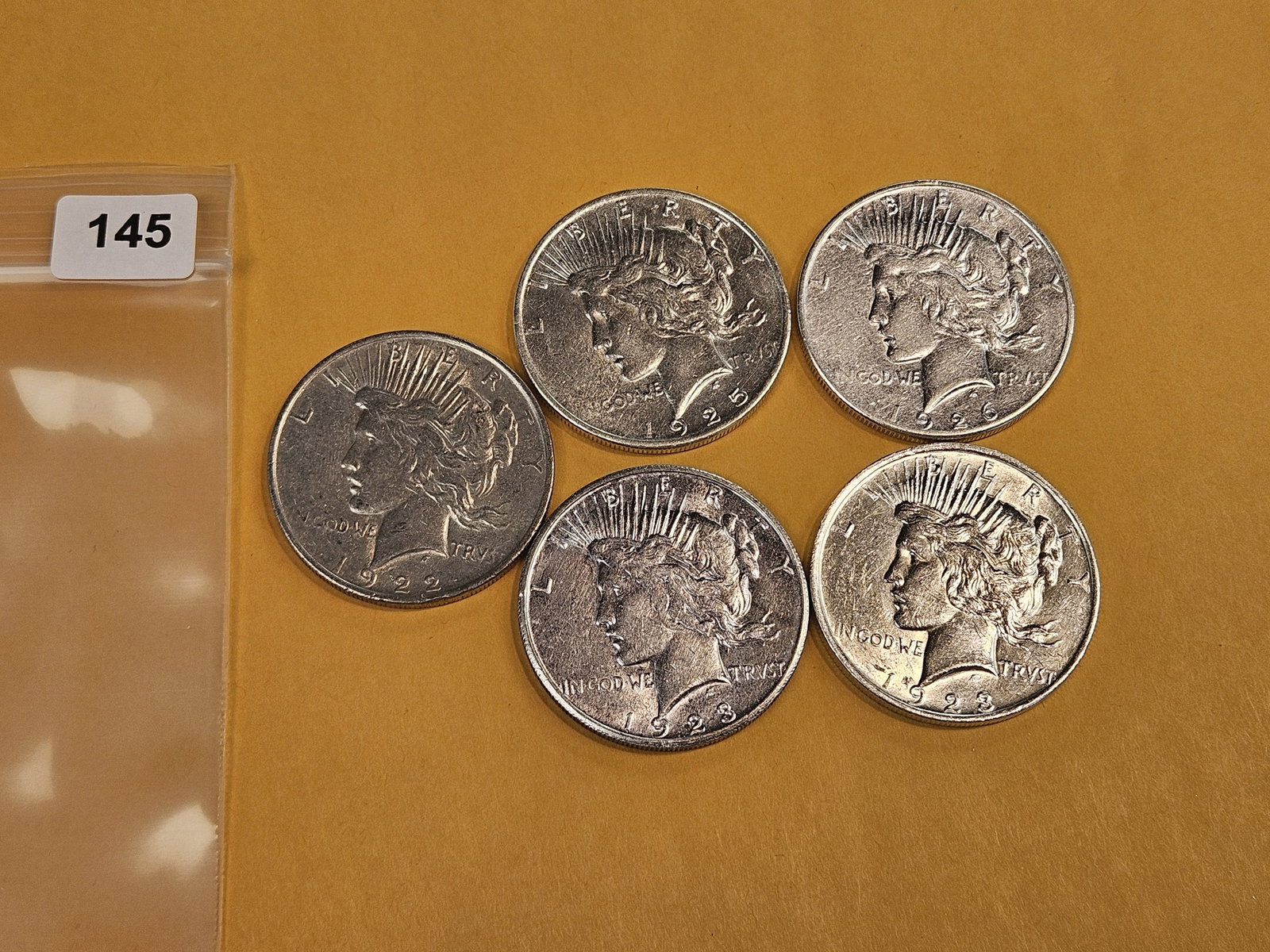 Five mixed Peace Silver Dollars - 2