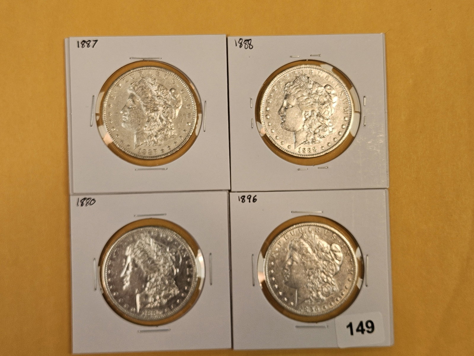 Four mixed Morgan Silver Dollars: Mixed dates and grades