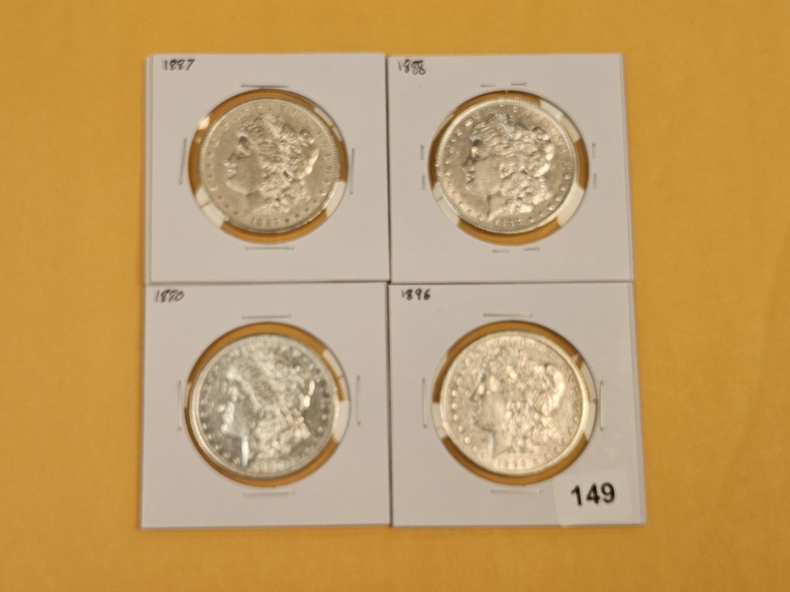 Four mixed Morgan Silver Dollars - 2