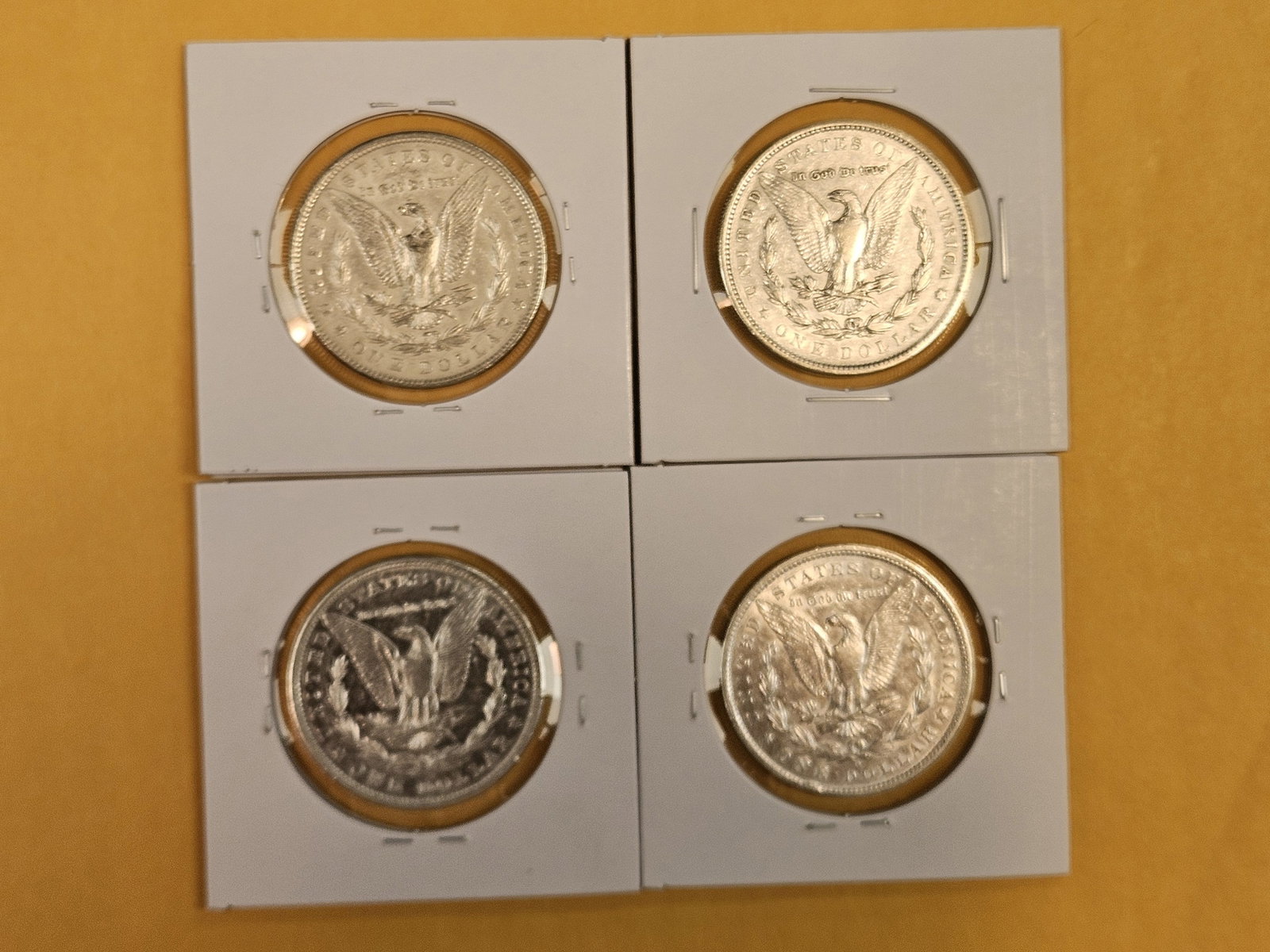 Four mixed Morgan Silver Dollars - 3