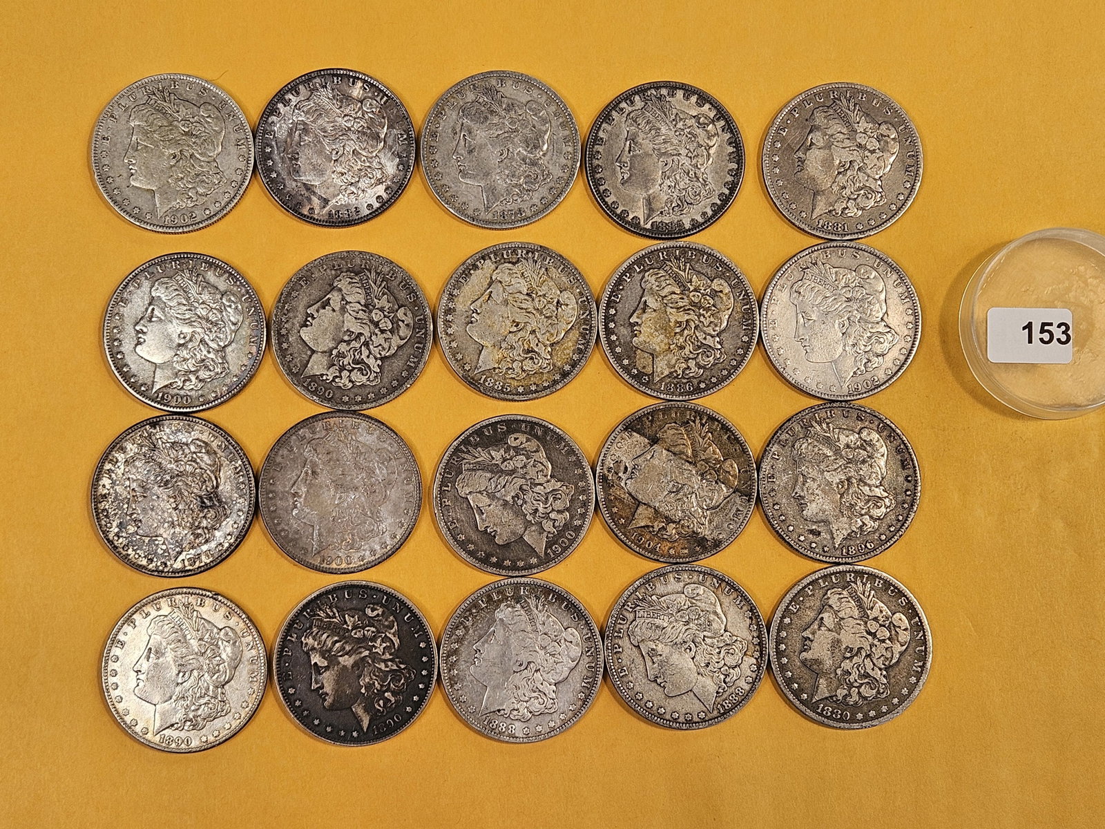 ** FULL ROLL ** Twenty Morgan Silver Dollars: All pre-1904. Grades from Fine through About Uncirculated plus - details
