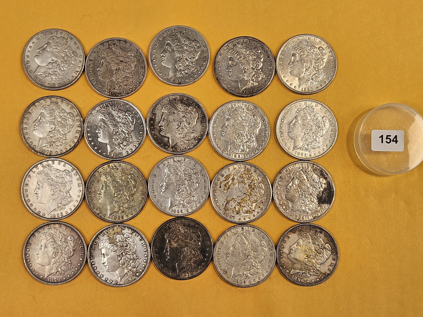** FULL ROLL ** Twenty Morgan Silver Dollars: All pre-1904. Grades from Fine through Uncirculated - details