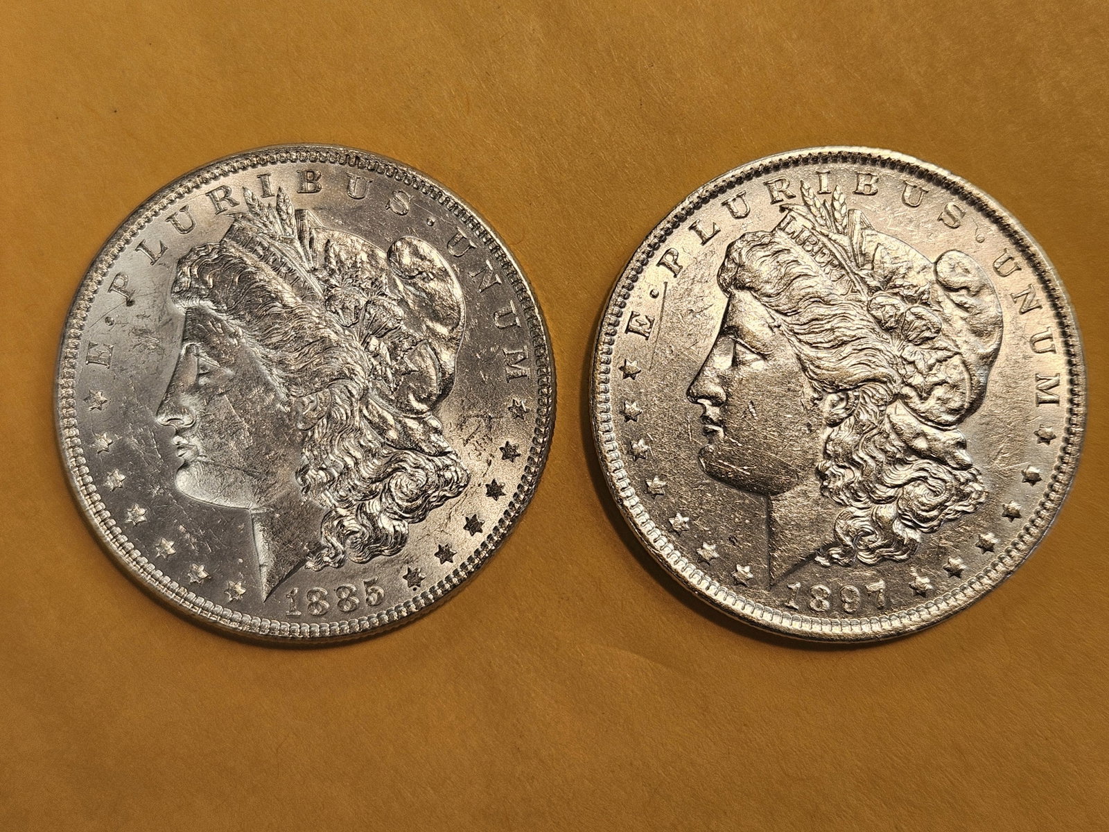 Two Brilliant About Uncirculated plus Morgan Dollars: Mixed