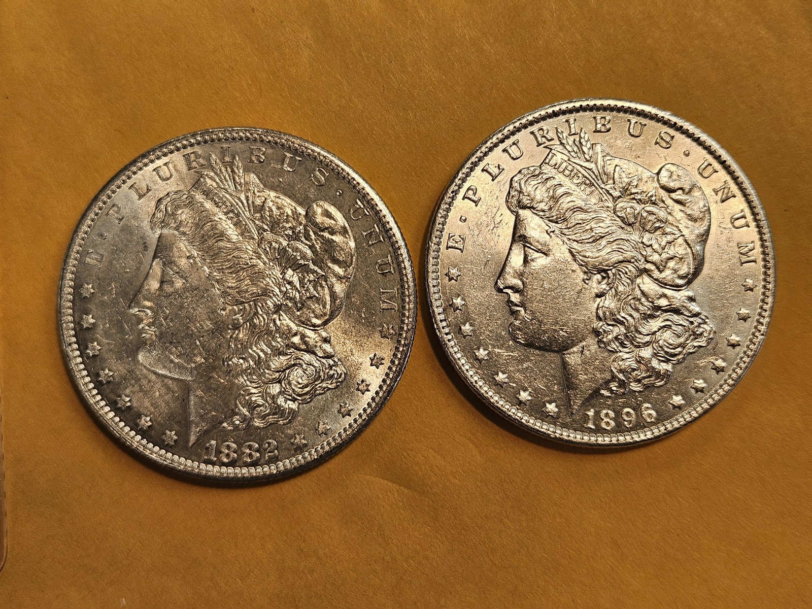 Two Brilliant About Uncirculated plus Morgan Dollars: Mixed
