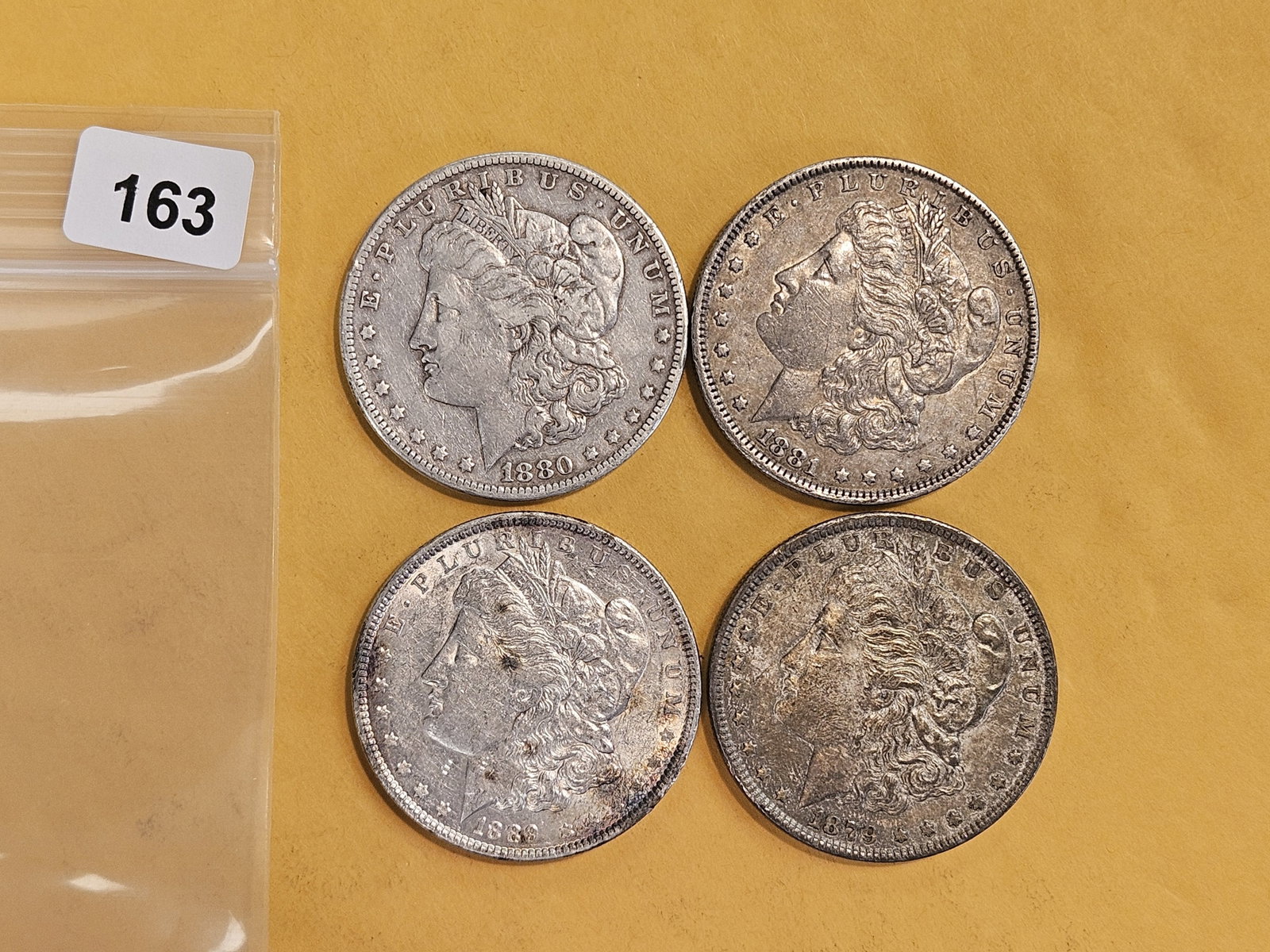 Four mixed Morgan Silver Dollars: Circulated