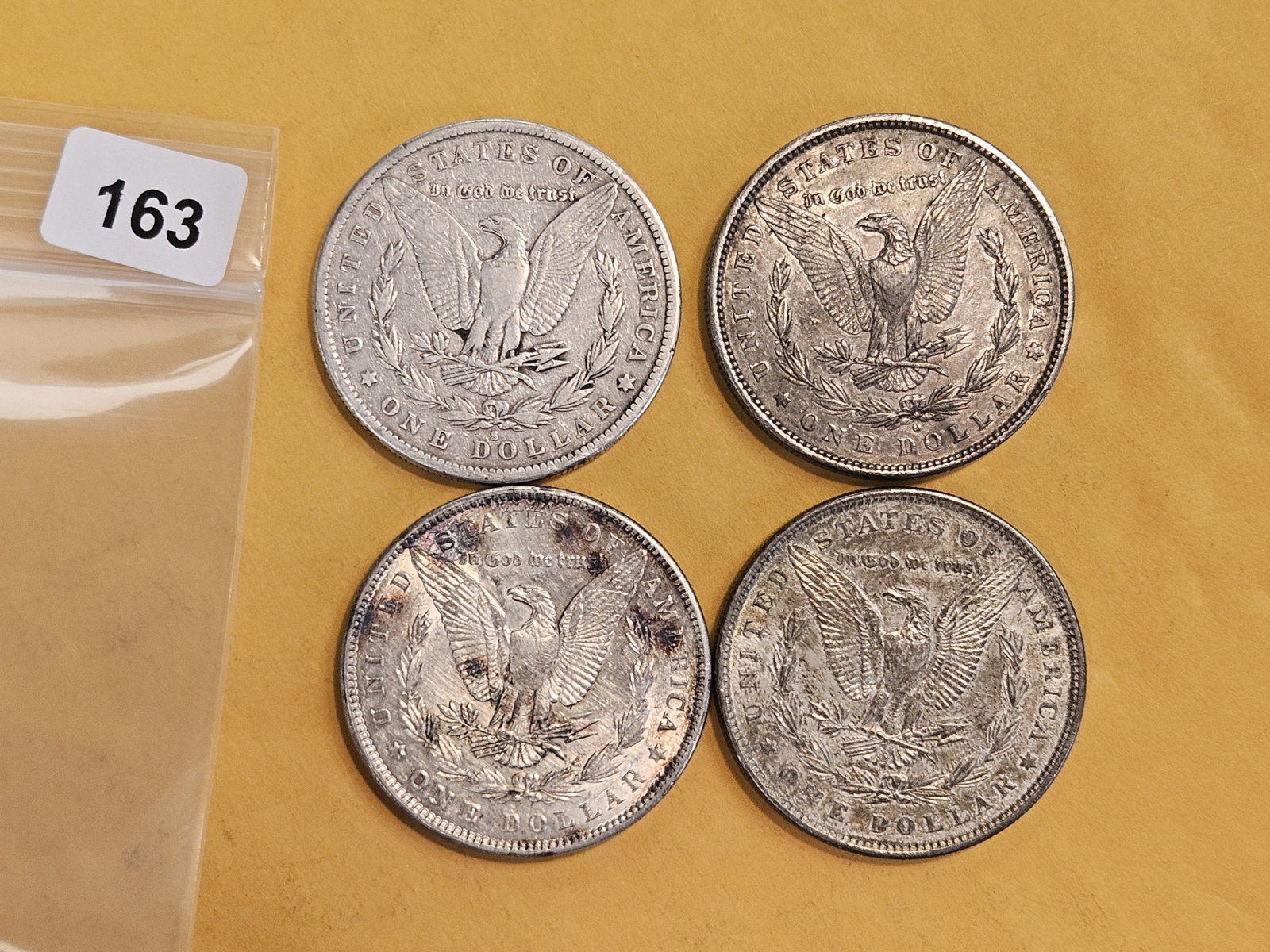 Four mixed Morgan Silver Dollars - 2