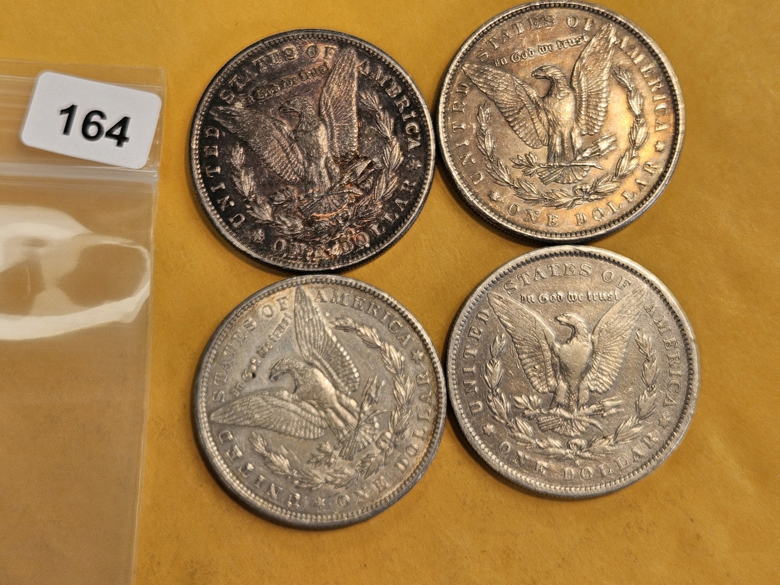 Four mixed Morgan Silver Dollars - 2