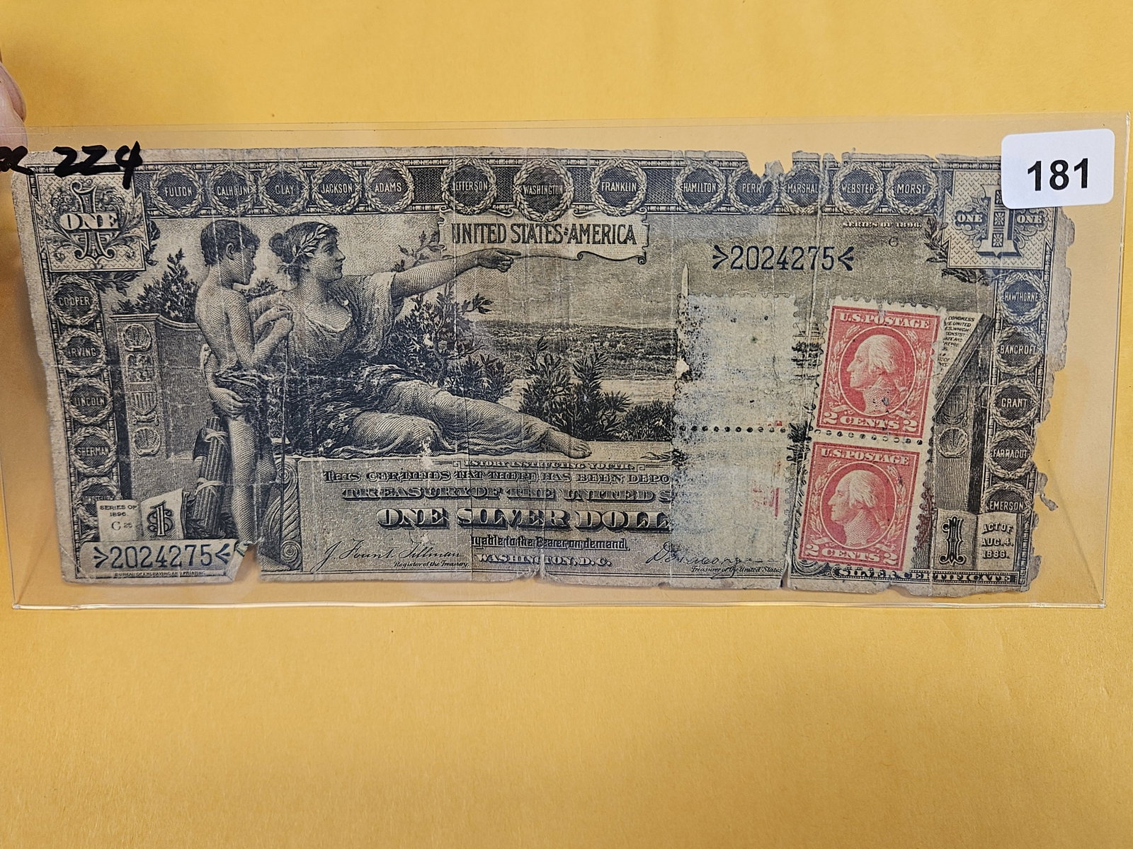 Series of 1892 Large Size One Dollar Silver Certificate: Educational Series. FR 224. With attached 2 cent postage