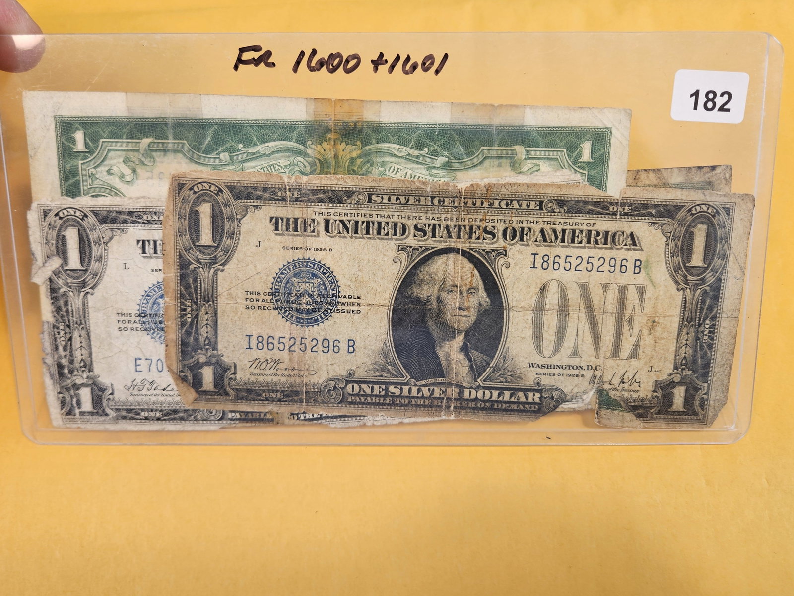 Three mixed One Dollar Silver certificates: FR 1600 and 1601. All well circulated and with issues. Prefer to not take them out of the holder to avoid degrading them any more