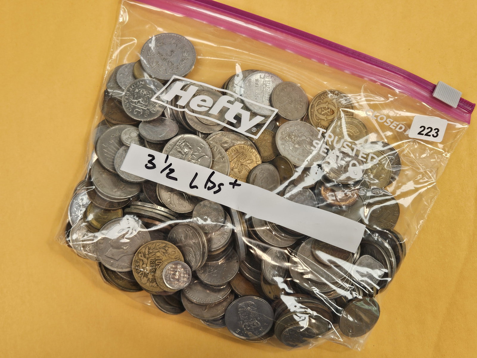 THREE and one-half pounds of mixed World Coins: From dealer. Unchecked by us