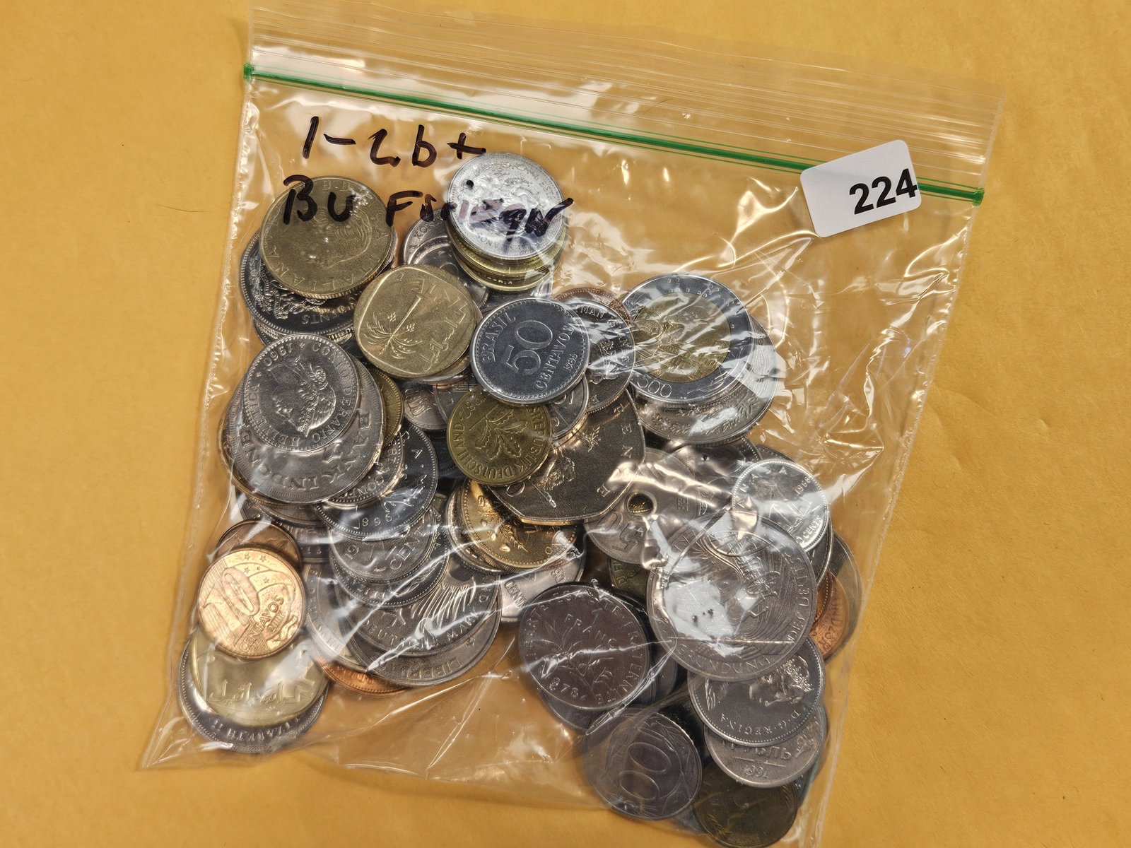Over 1 Pound of mixed, Uncirculated, World coins: From dealer. Unchecked by us