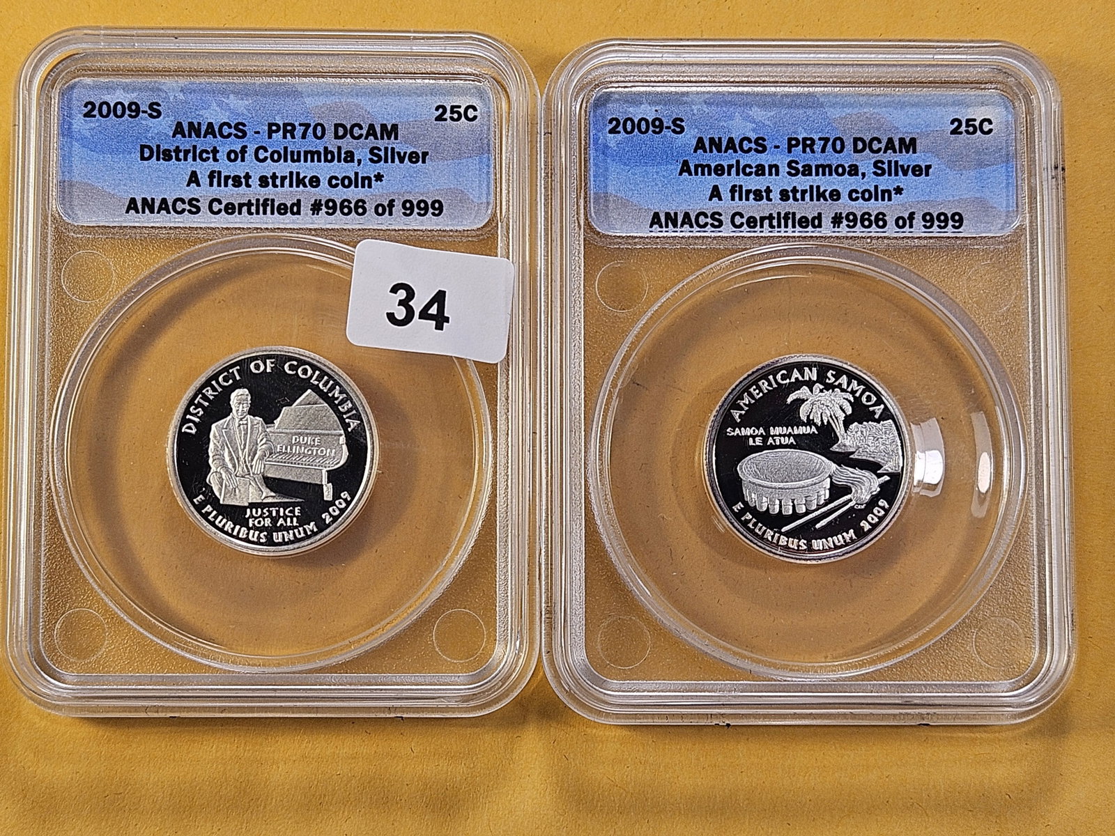 PERFECT! Two ANACS 2009-S Washington Silver Quarters in Proof 70 Deep Cameo: Perfect Grades! District of Columbia and American Samoa