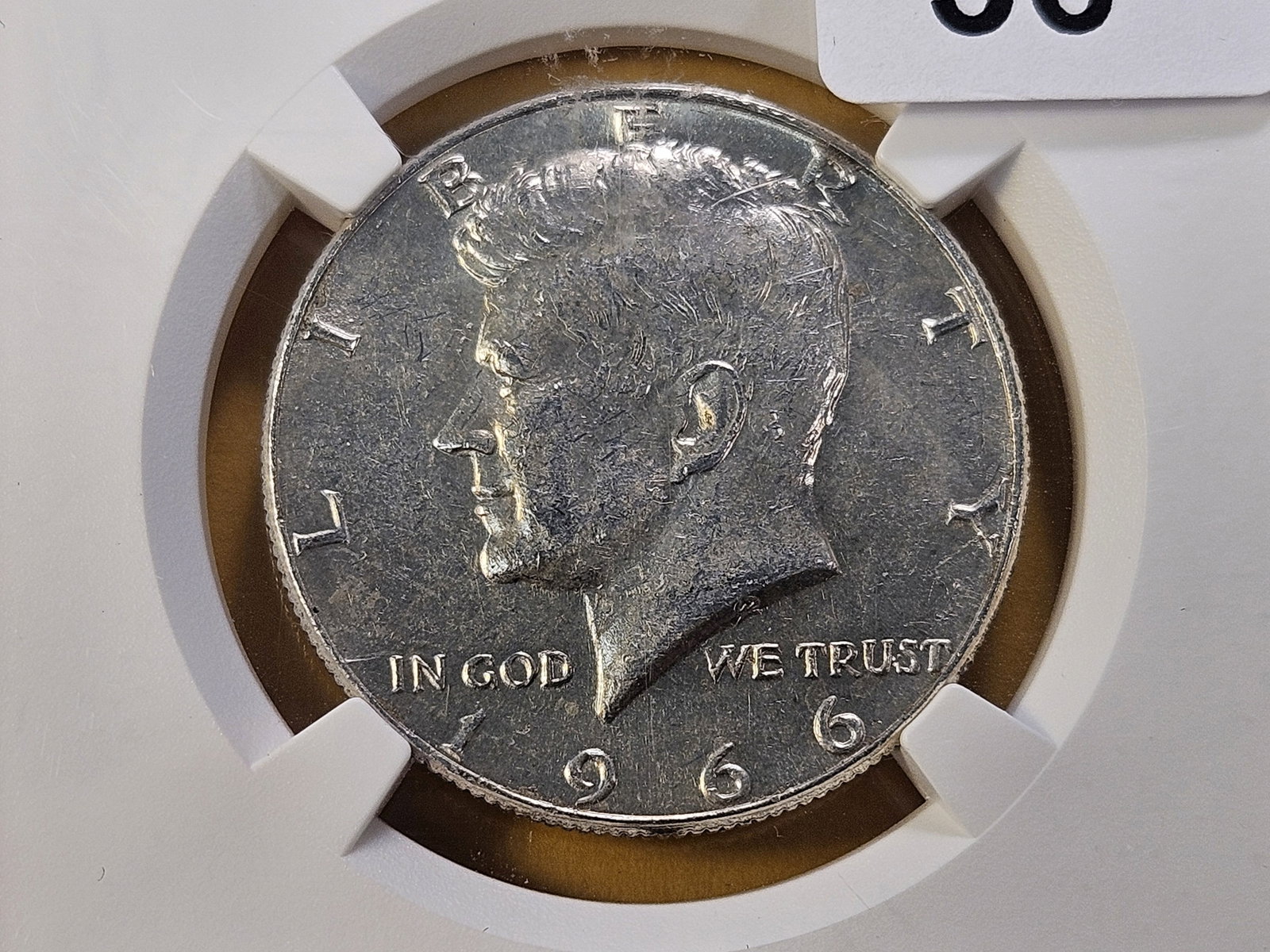 NGC 1966 Kennedy Silver Half Dollar in Genuine: Nice About Uncirculated!