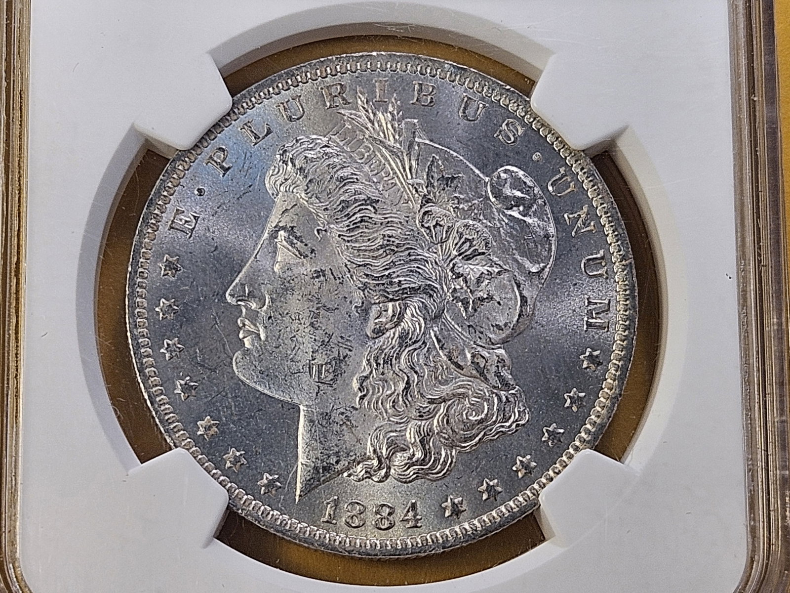 VARIETY! 1884-O/O Morgan Silver Dollar in Mint State 63: Choice Brilliant Uncirculated! VAM-10. Repunched Mint Mark