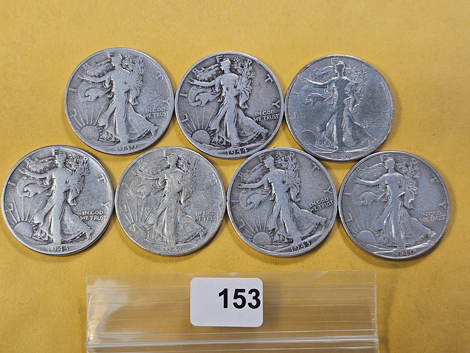 Seven Circulated Walking Liberty Silver Half Dollars: Mixed dates and grades
