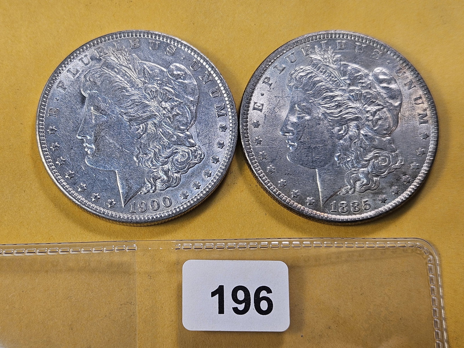 Two About Uncirculated Morgan Silver Dollar: 1885 and 1900