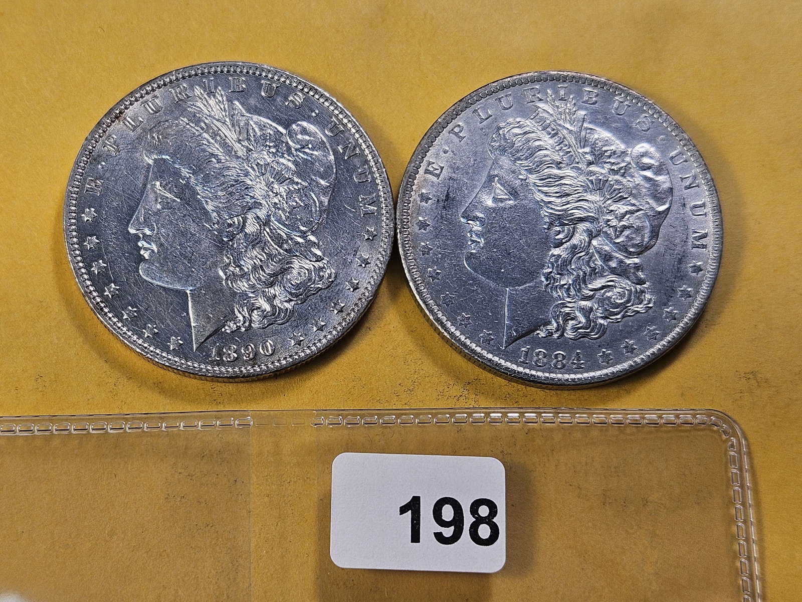 Two About Uncirculated Morgan Silver Dollar: 1884-O and 1890