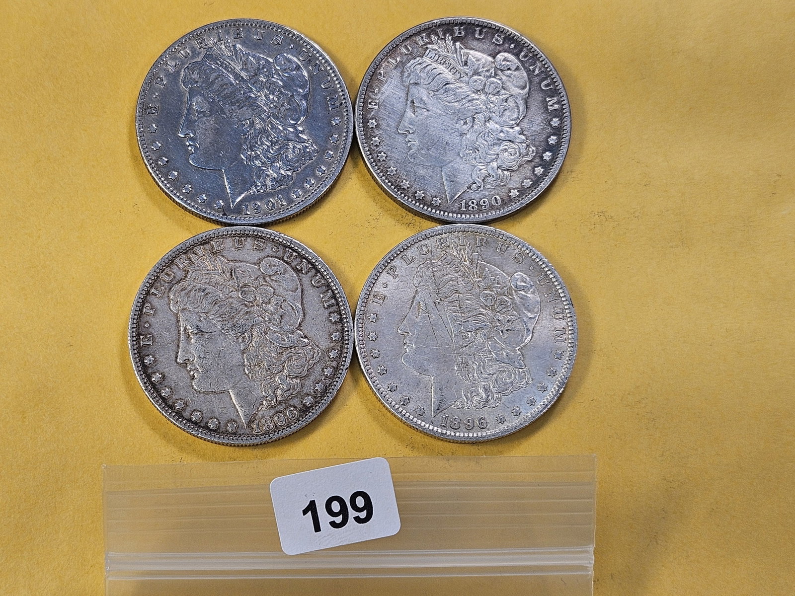 Four Circulated Morgan Silver Dollars: 1890, 1901-O and two 1896